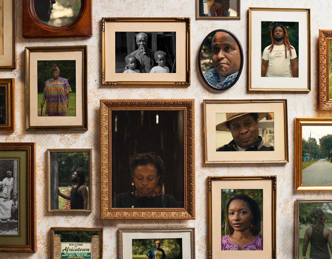 Some framed photographs of Africatown residents and descendants.