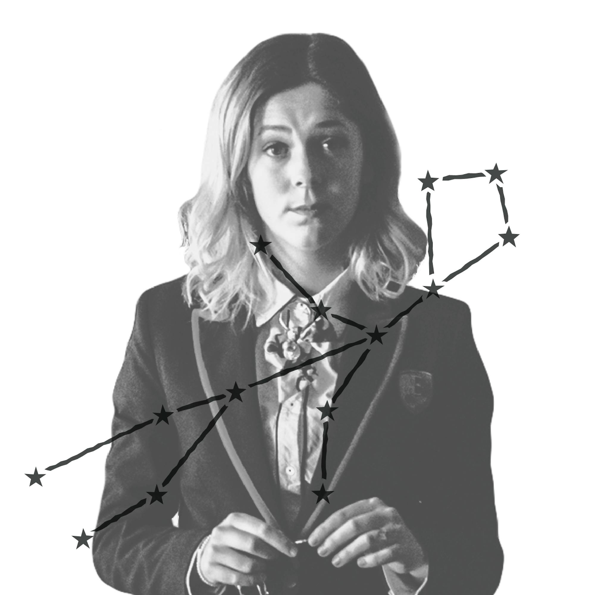 Cayetana Grajera Pando (played by Georgina Amorós) is all business in her school blazer in this still from <i>Elite</i>. She looks like she gets what she wants. Over the image is an illustration of Cayetana’s zodiac constellation.