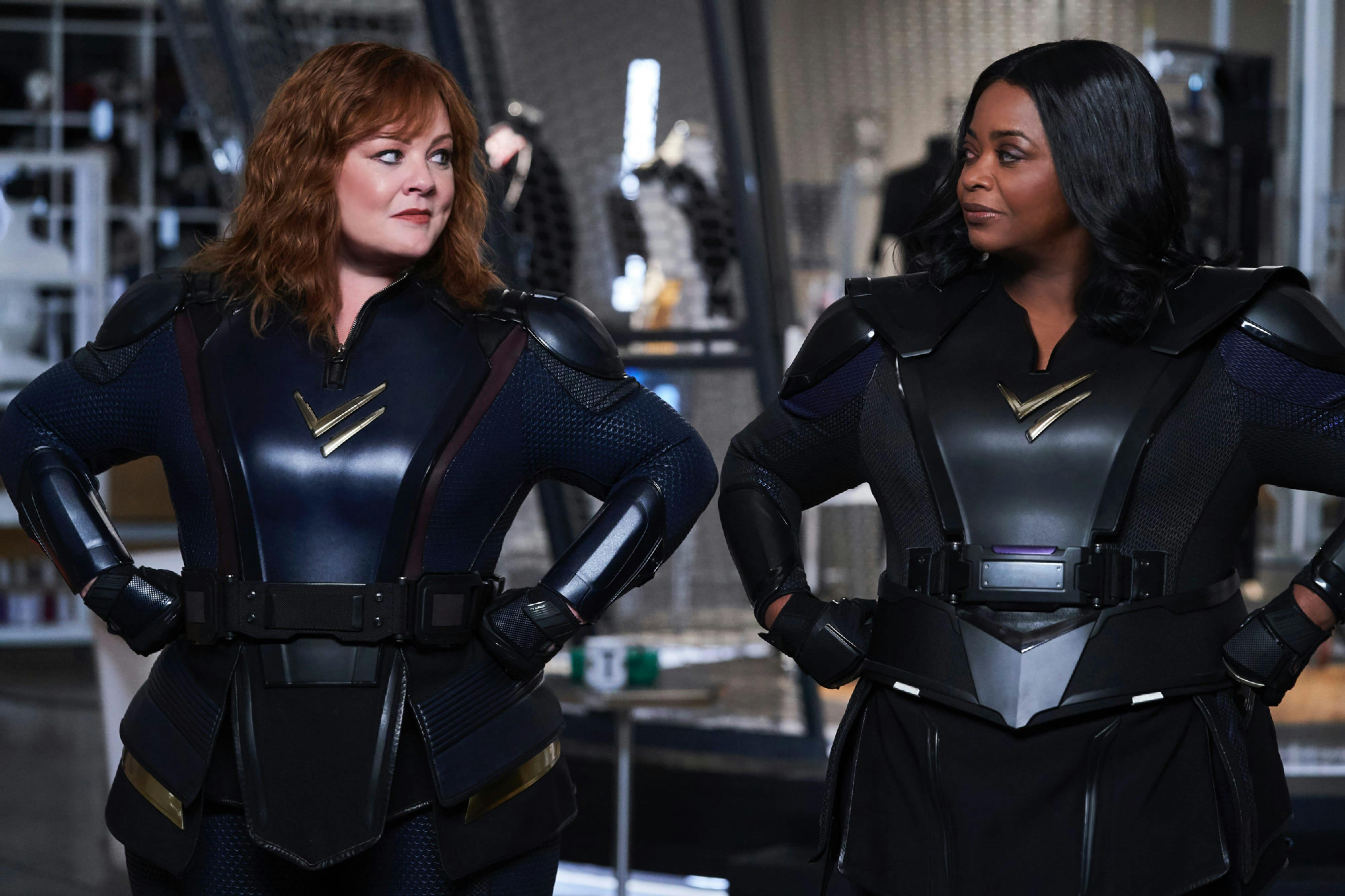 Clad in intimidating yet chic superhero suits, Melissa McCarthy and Octavia Spencer stand with their hands on hips looking at each other. They look like they could save the world!