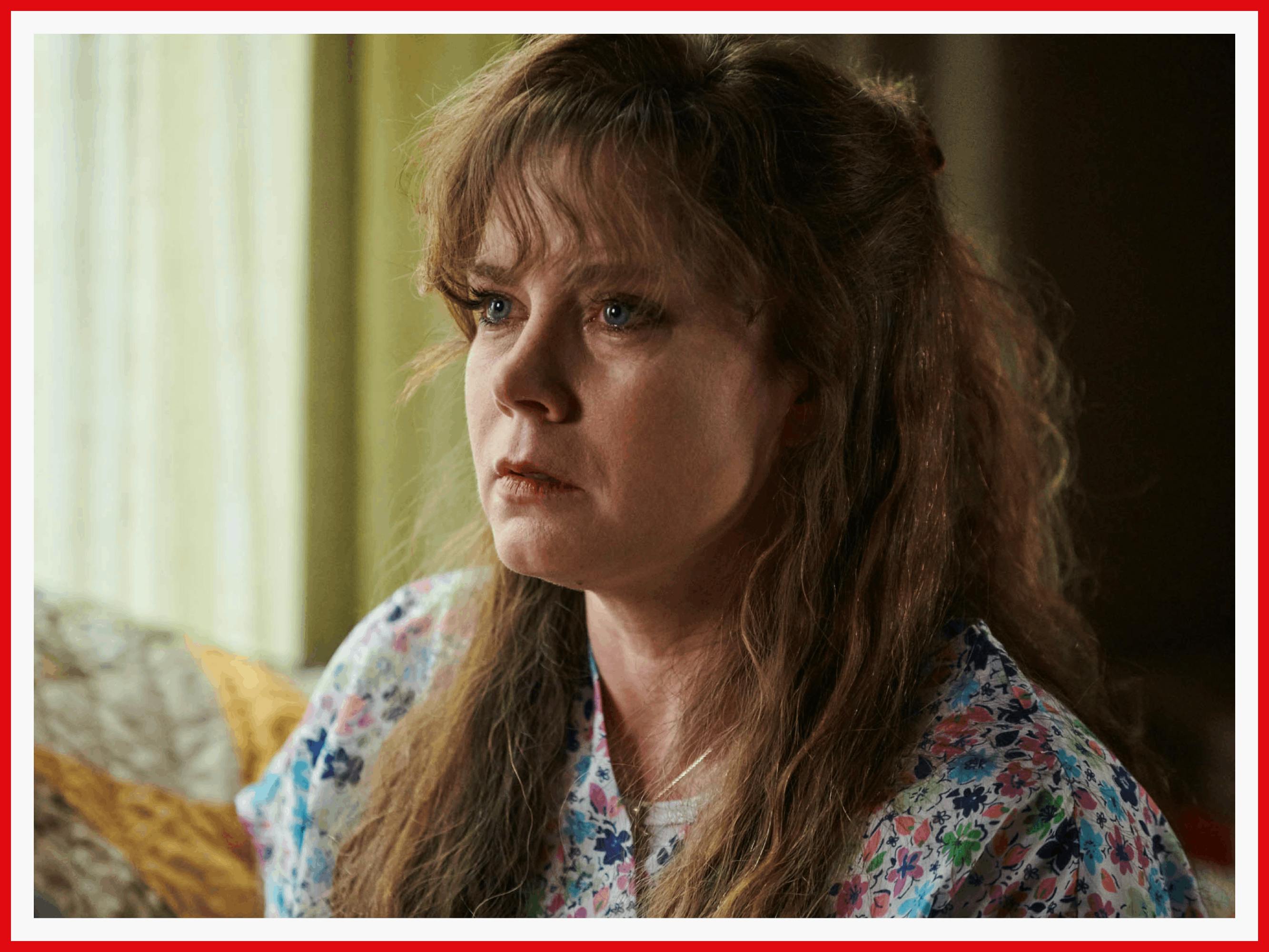 Amy Adams as Bev has messy, red hair and retro bangs