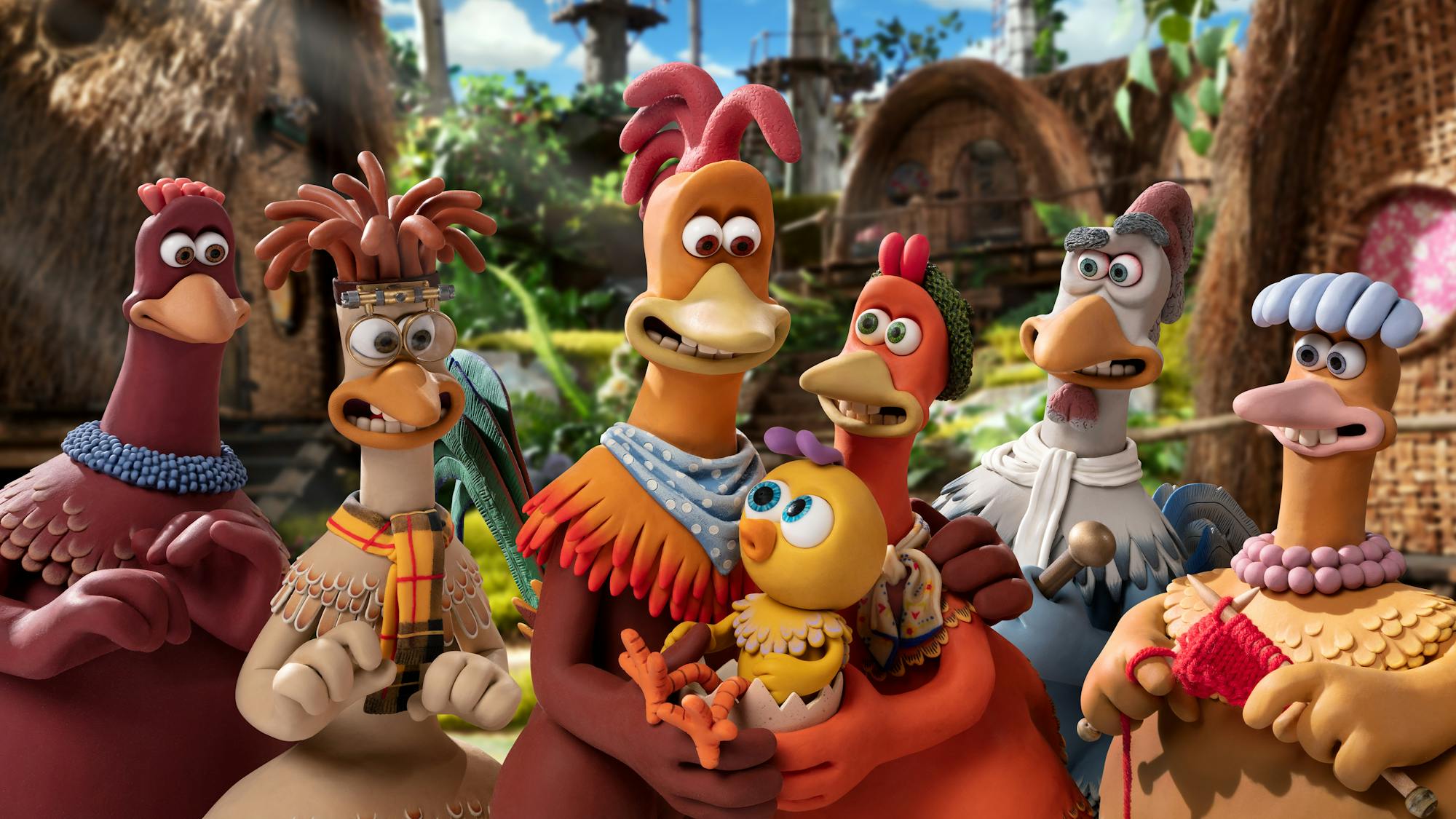 Bunty (Imelda Staunton), Mac (Lynn Ferguson), Rocky (Zachary Levi), Molly (Bella Ramsey), Ginger (Thandiwe Newton), Fowler (David Bradley), and Babs (Jane Horrocks) in Chicken Run: Dawn of the Nugget stand together wearing an eclectic mix of outfits.