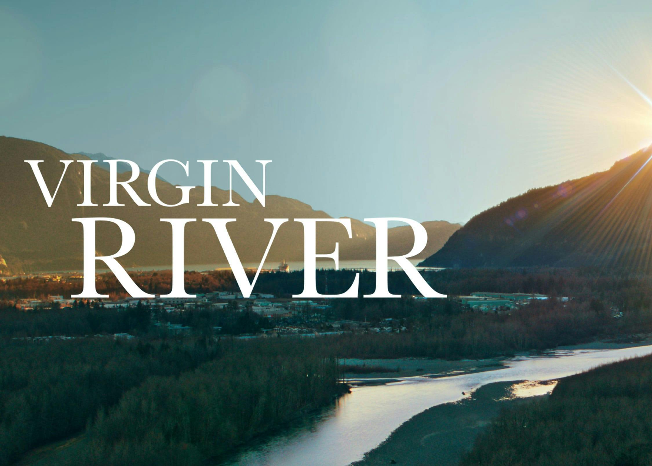 The key art for the show Virgin River. The title is in white font, and the river scene is serene, lit by a golden sun.