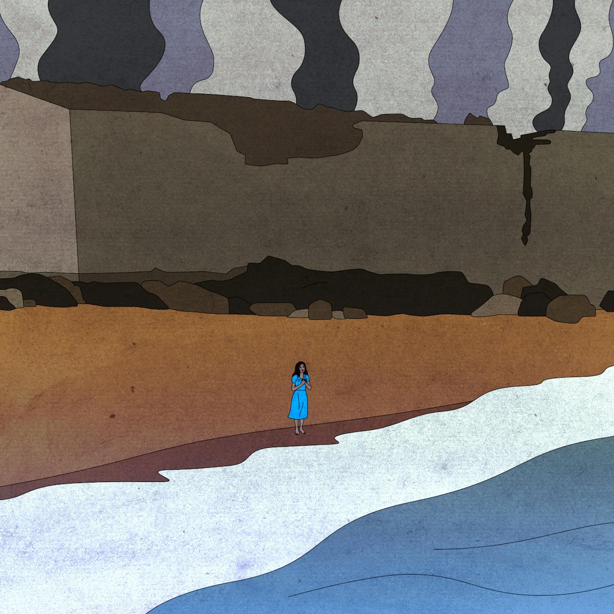 Marie-Laure stands at the edge of the ocean on a beach. Behind her are smoke clouds billowing ominously.