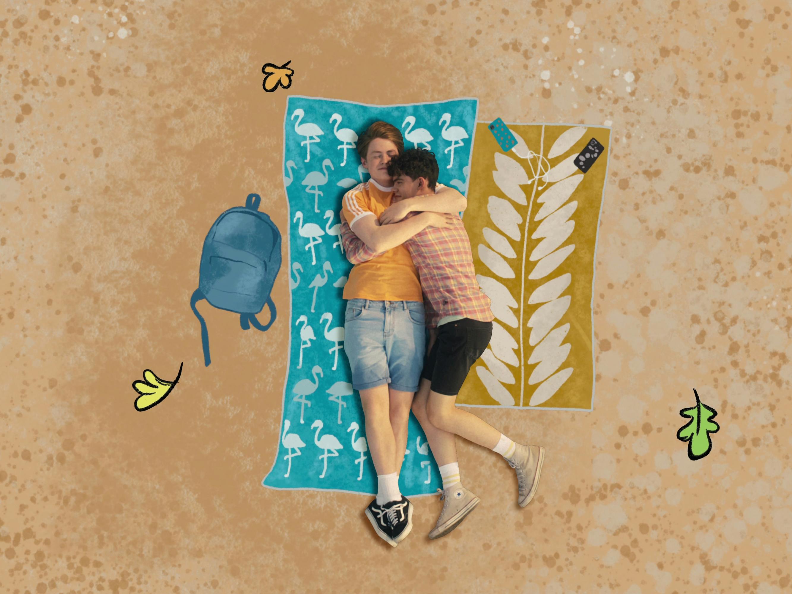 Charlie Spring (Joe Locke) and Nick Nelson (Kit Connor) lie on a beach towel on a sandy beach.