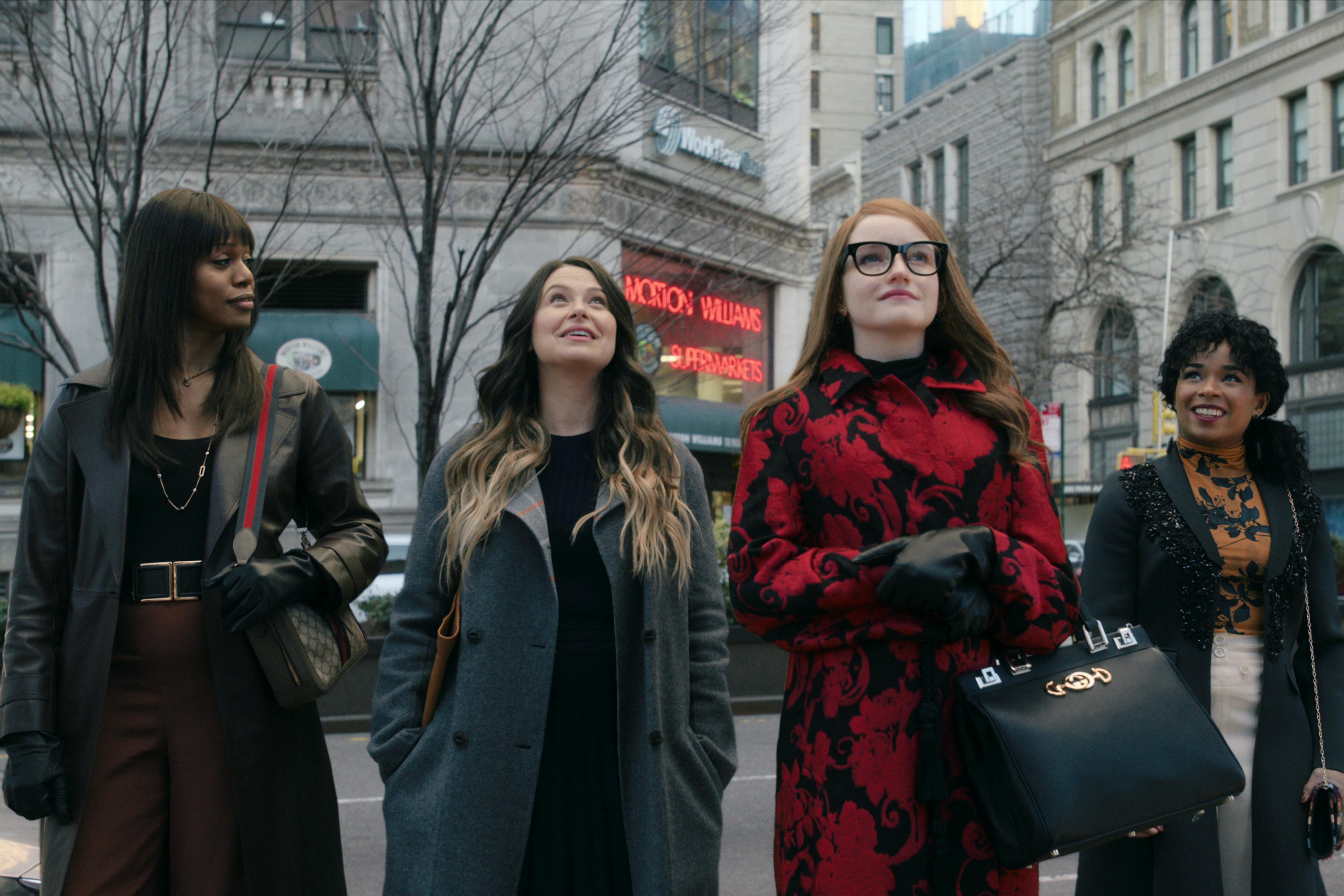 Kacy Duke (Laverne Cox), Rachel Williams (Katie Lowes), Anna Delvey (Julia Garner), and Neff (Alexis Floyd) stand in front of Anna's dream building — 281 Park. 