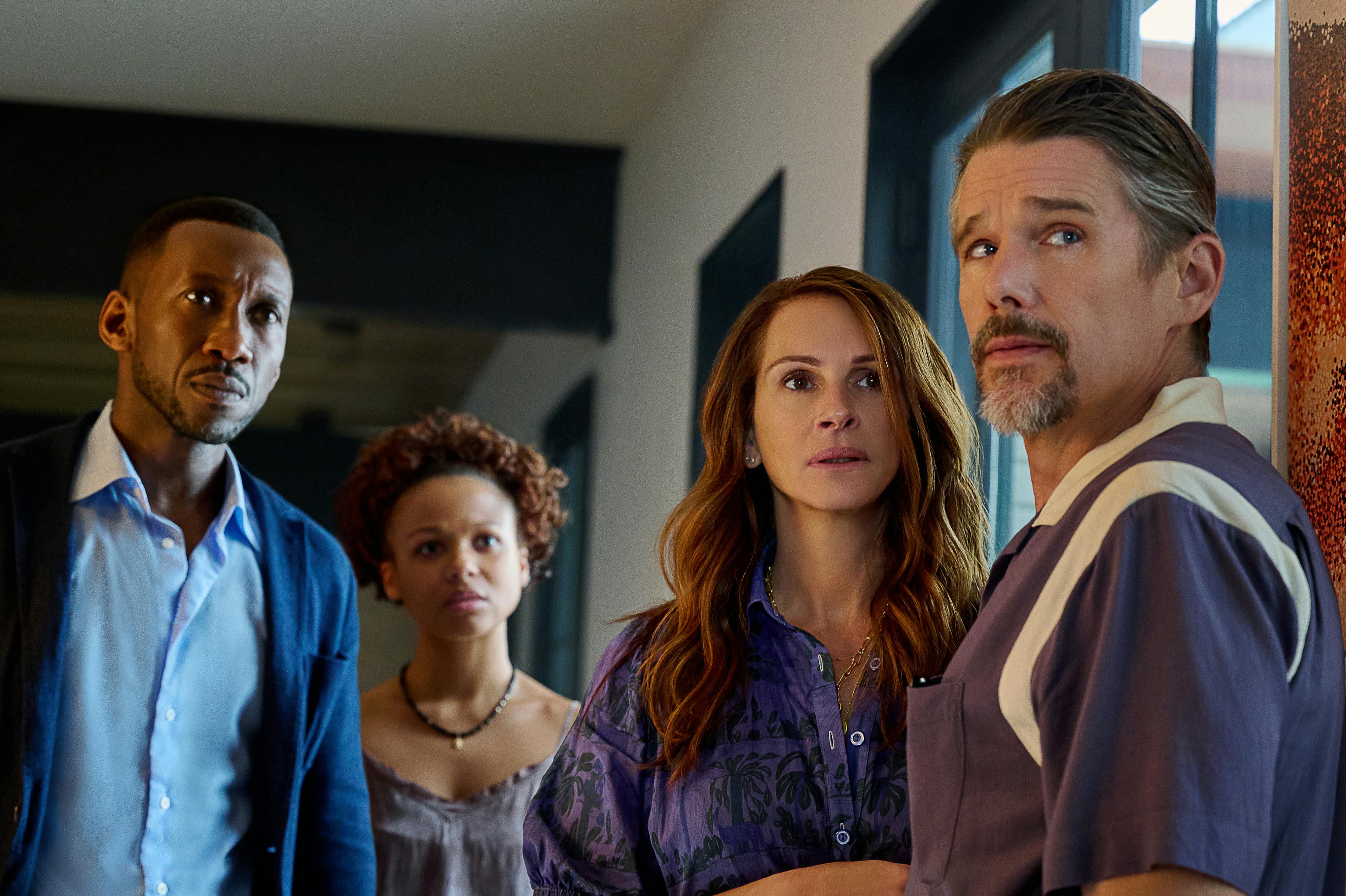 Mahershala Ali, Myha’la, Julia Roberts, and Ethan Hawke stand together in an airy kitchen.