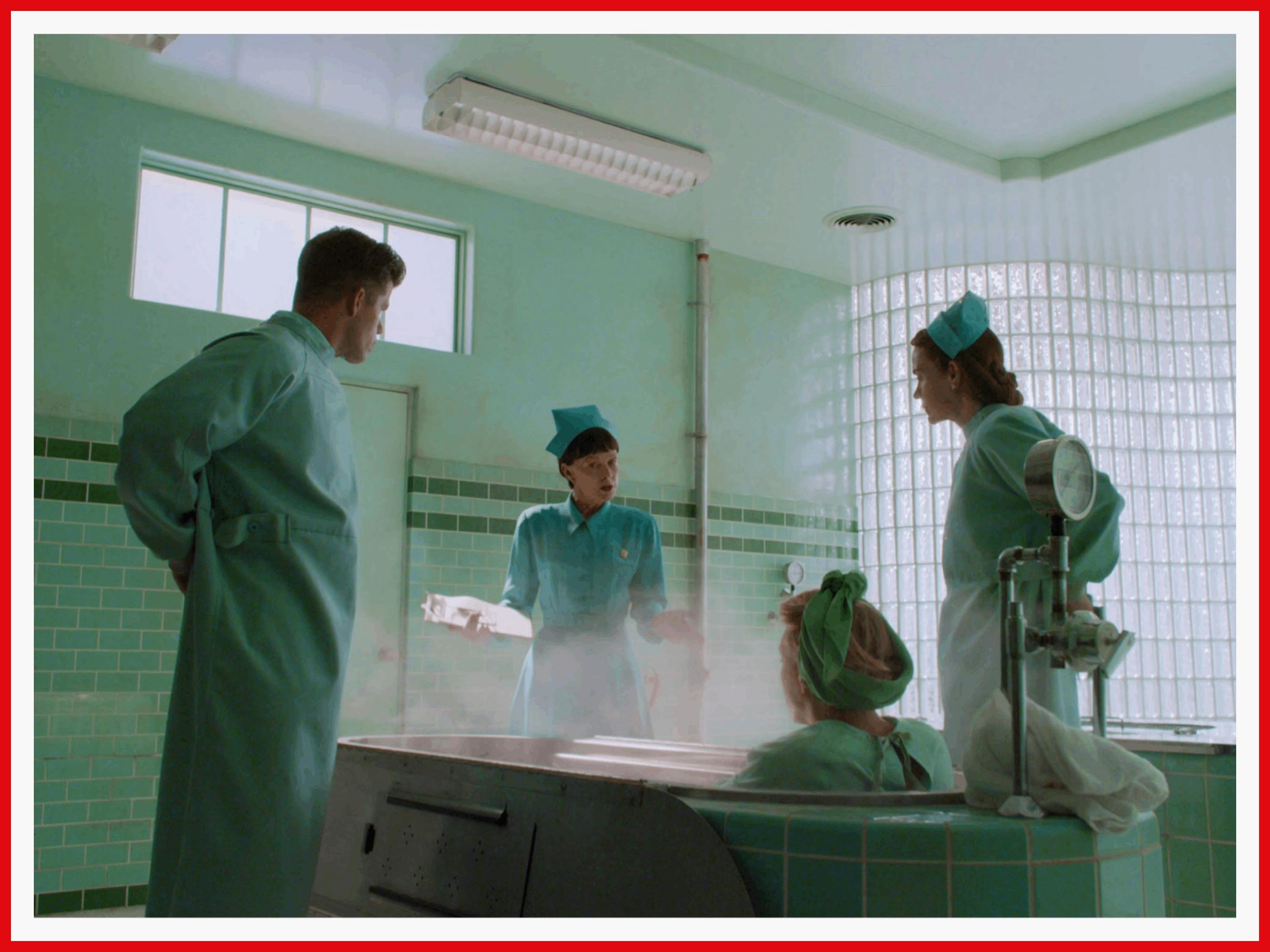 Between the tiled hospital walls and the actors’ nurse costumes, it’s green overload.
