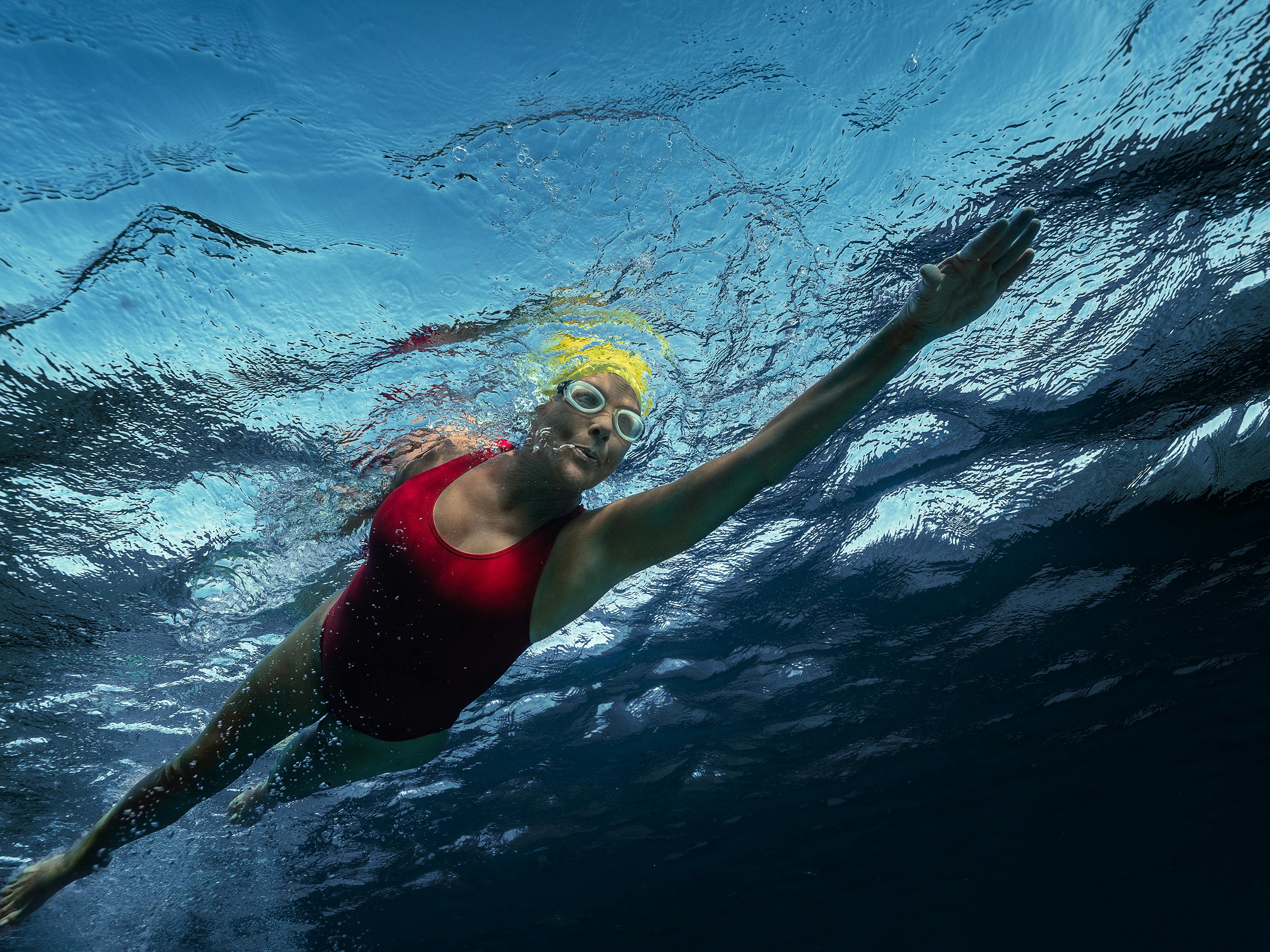 Diana Nyad (Annette Bening) swims through the ocean in this underwater shot.