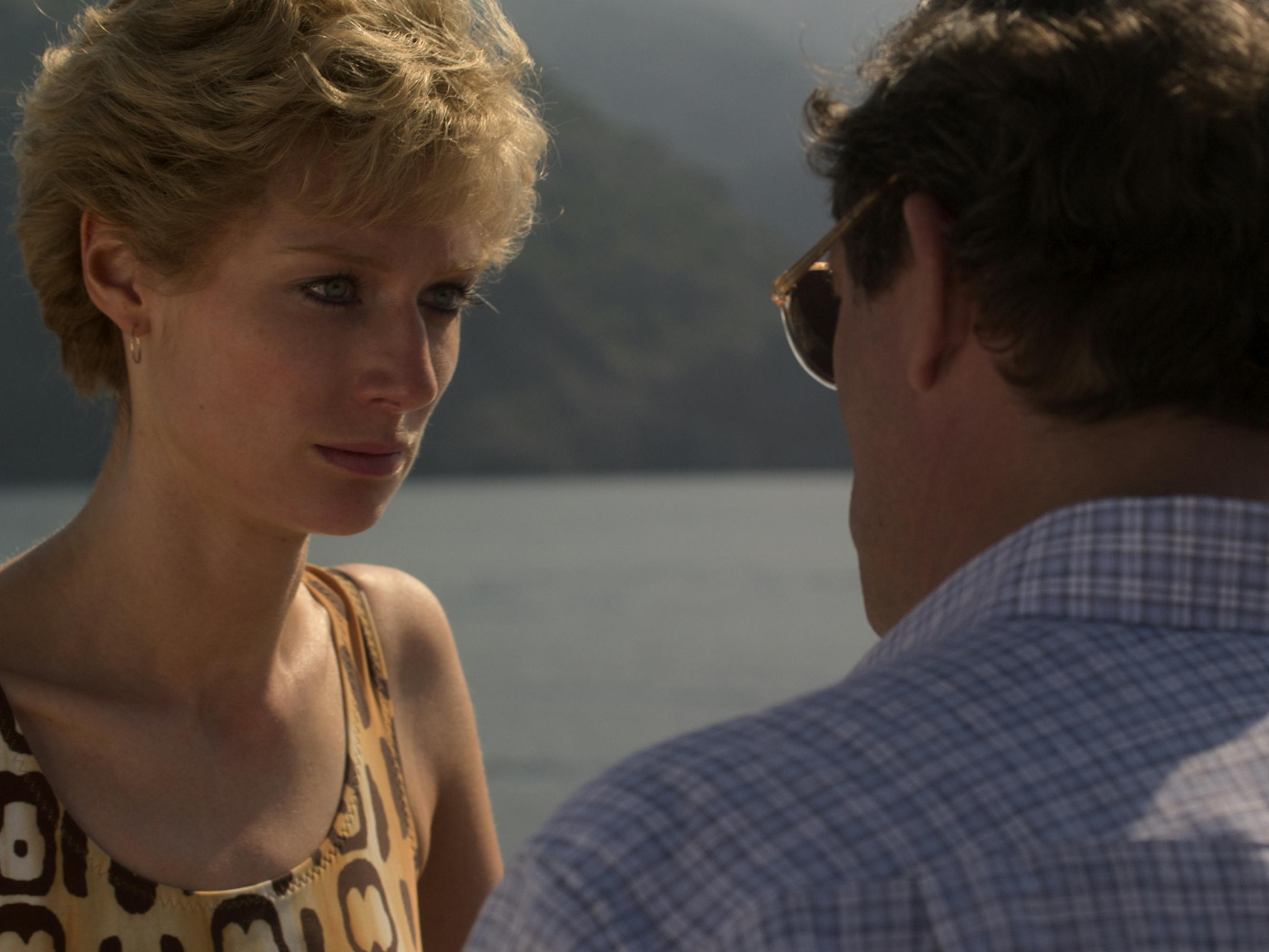 Princess Diana (Elizabeth Debicki) and Prince Charles (Dominic West) face off in a sunlit shot.