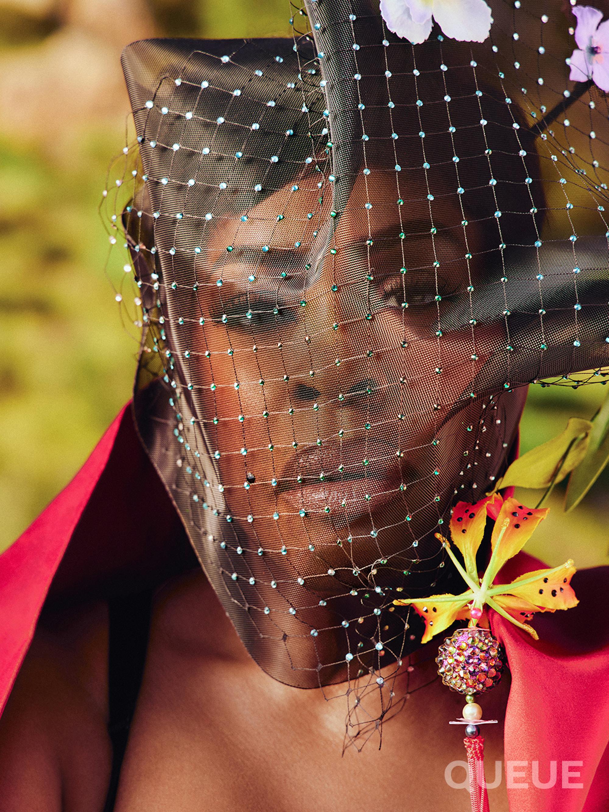 In this close-cropped shot, Niecy Nash-Betts wears a beaded veil.