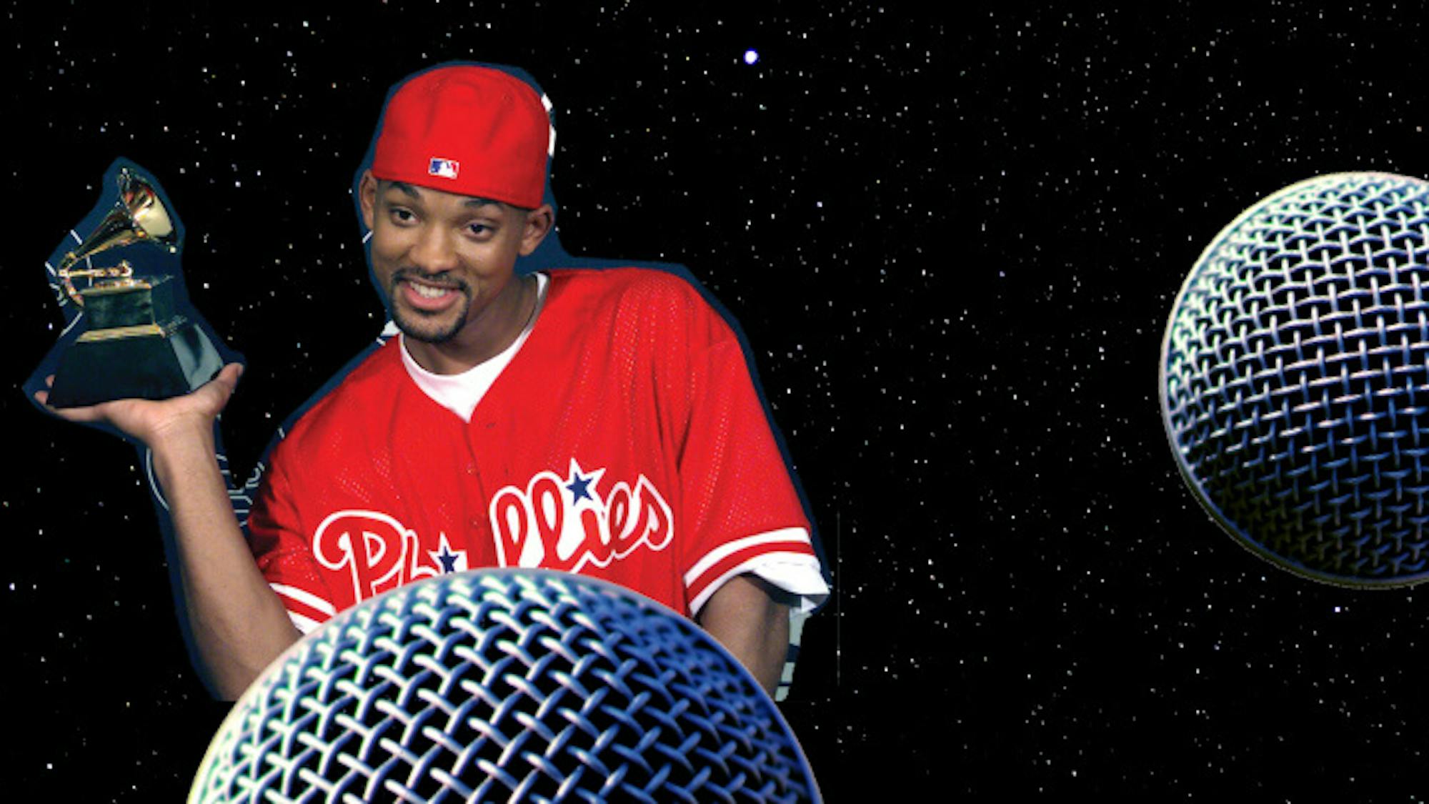 Will Smith hovers above a microphone planet with a Grammy perched casually on his palm. He reps the Phillies with both jersey and hat.