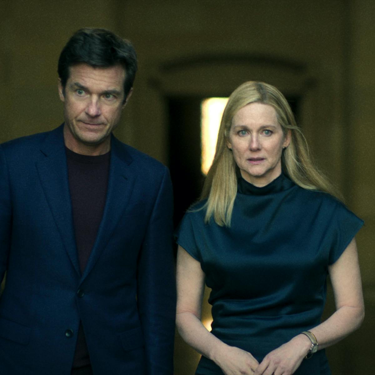 Marty Bryde (Jason Bateman) and Wendy Bryde (Laura Linney) wear navy and look solemn.