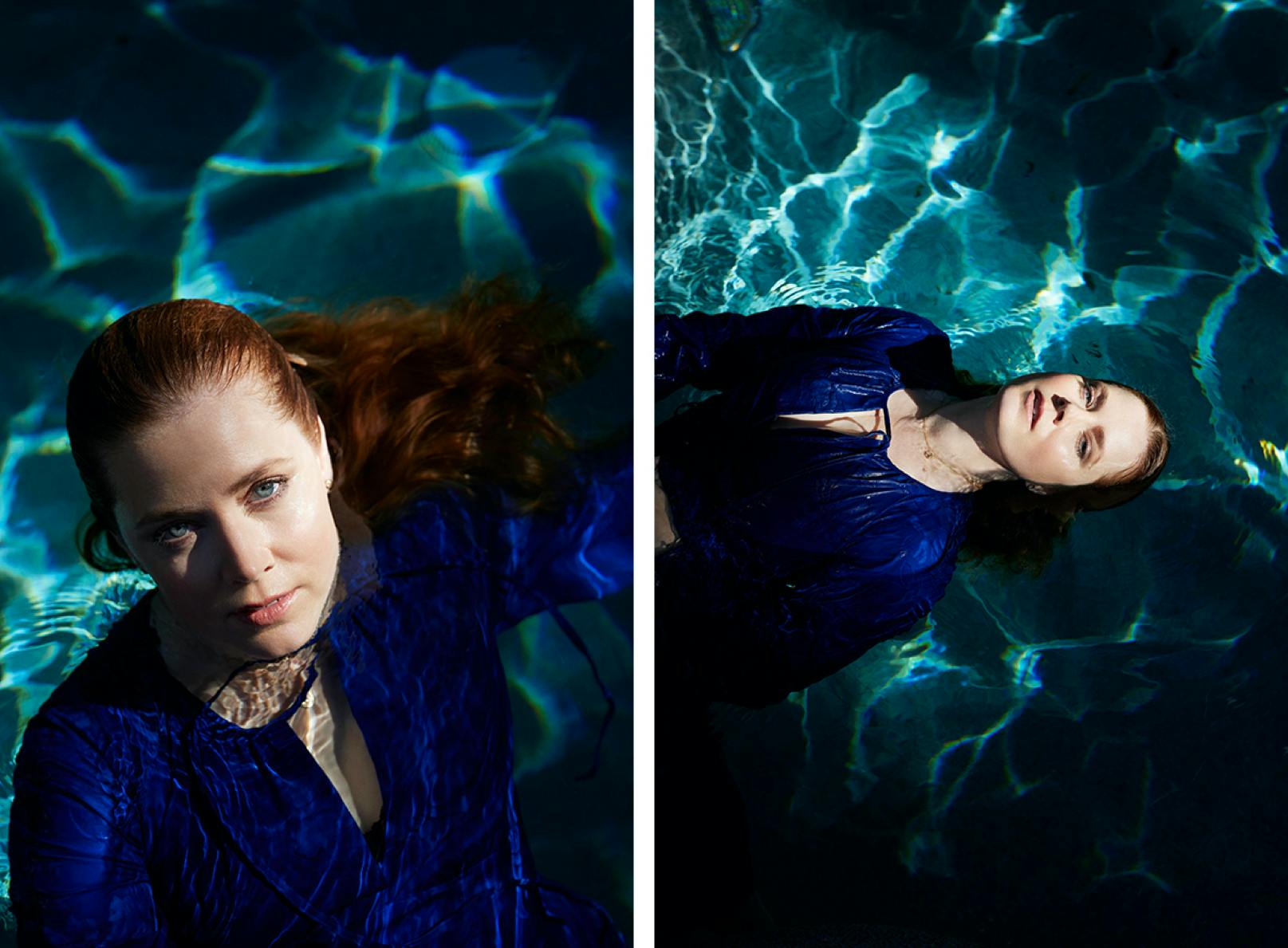 Amy Adams wears a dark blue dress and floats in her pool.