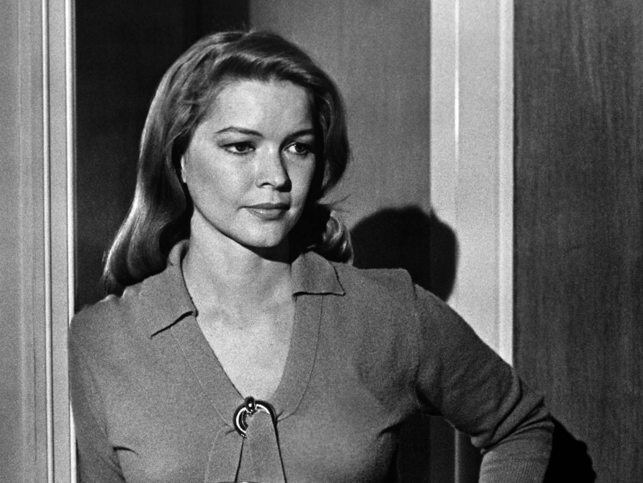 Ellen Burstyn as Lois Farrow in a still from The Last Picture Show. Burstyn was in her 30s when this film was shot. Here she appears posed in a doorway, hand on her hip. 