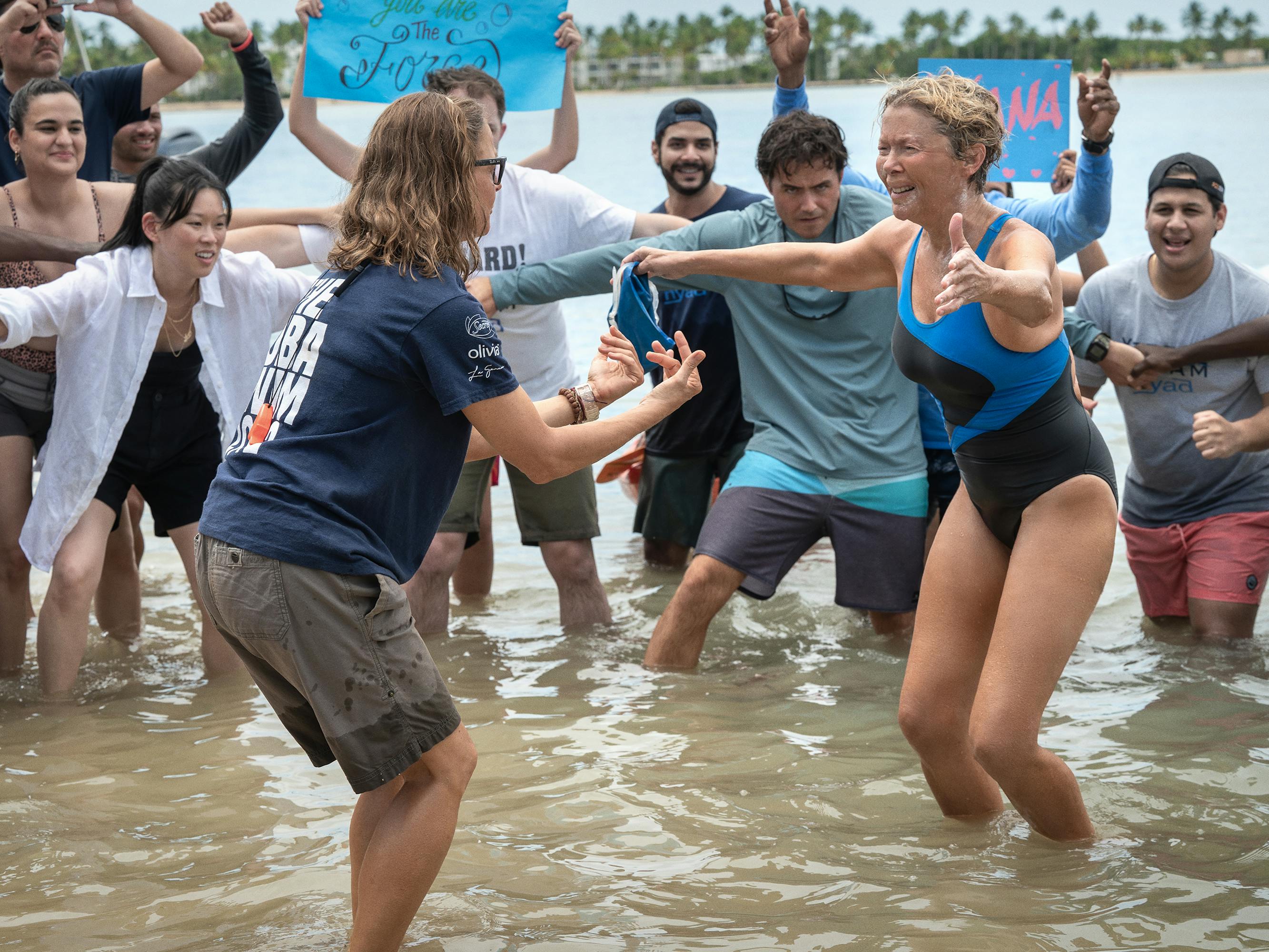 Bonnie Stoll (Jodie Foster) and Diana Nyad (Annette Bening) embrace in ankle-deep water.