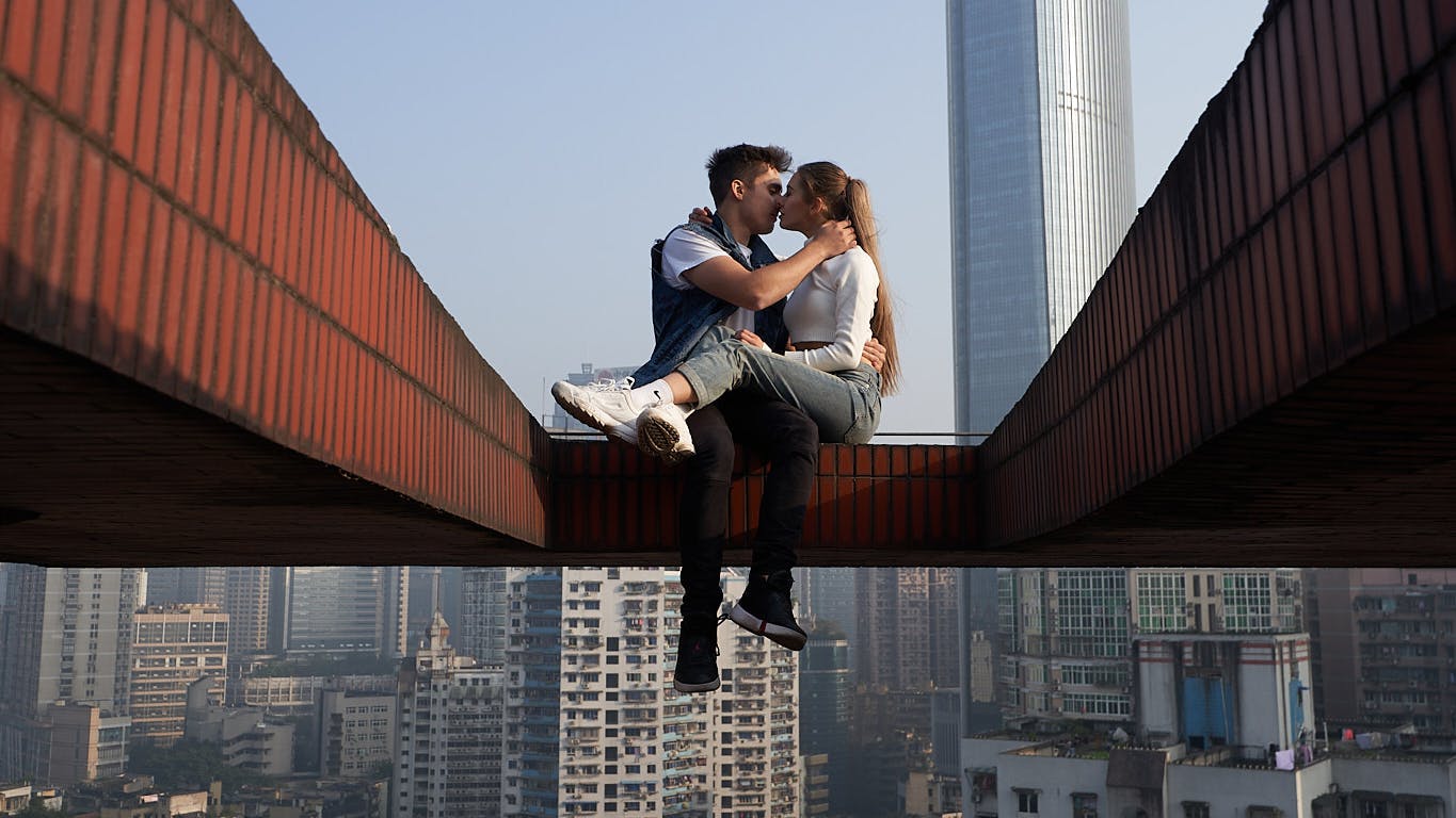  Ivan Beerkus and Angela Nikolau embrace on some scaffolding far above the city.