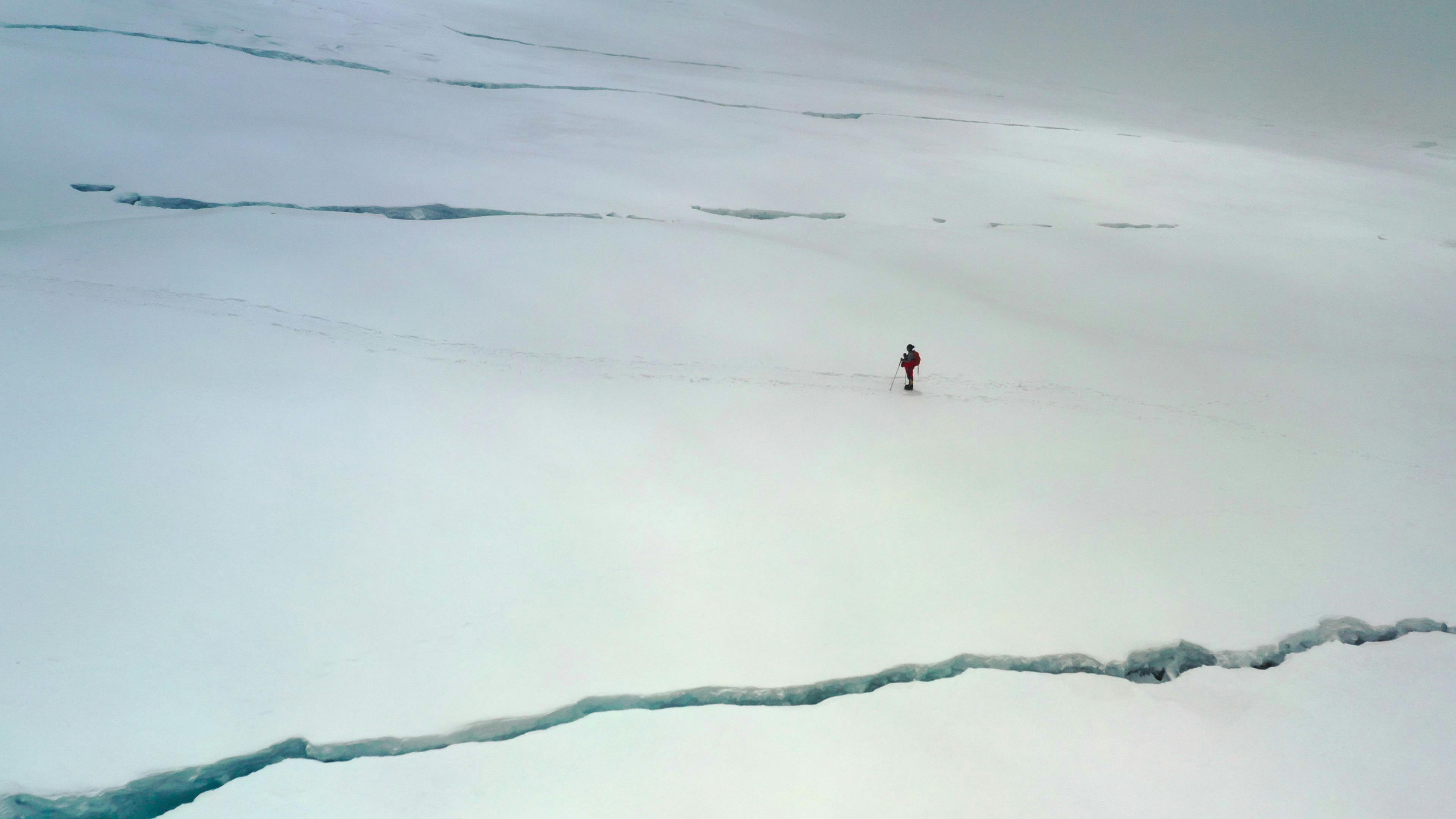 Lhakpa Sherpa walks on a snowy, icy expanse.