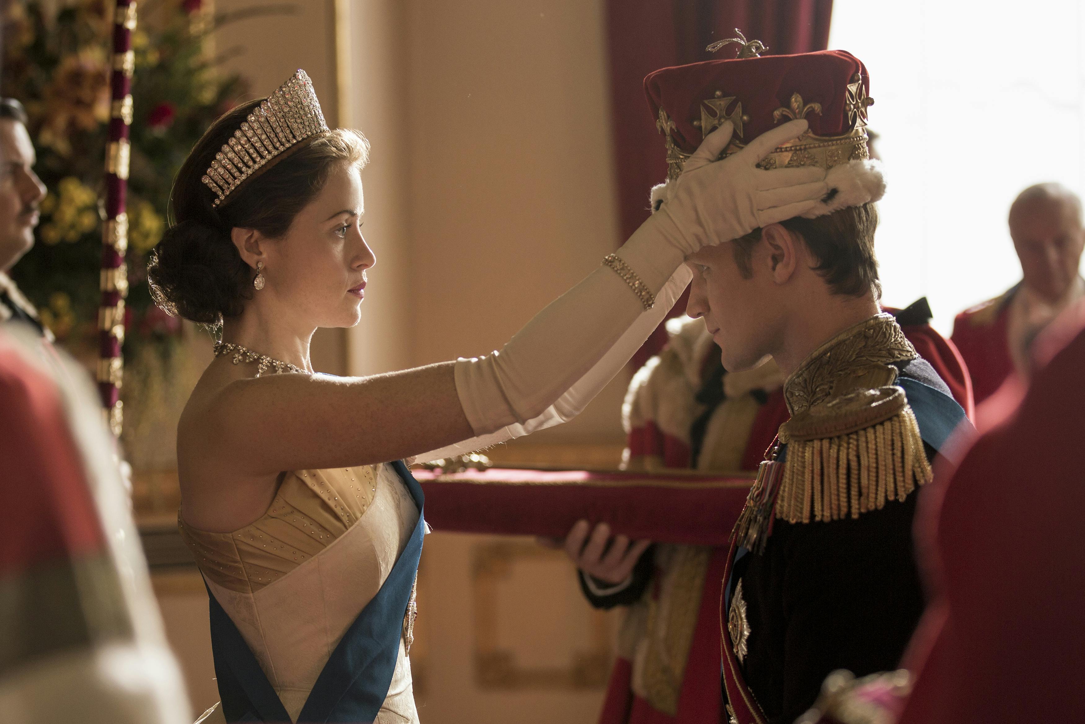 Queen Elizabeth (Claire Foy) crowns Prince Philip (Matt Smith).