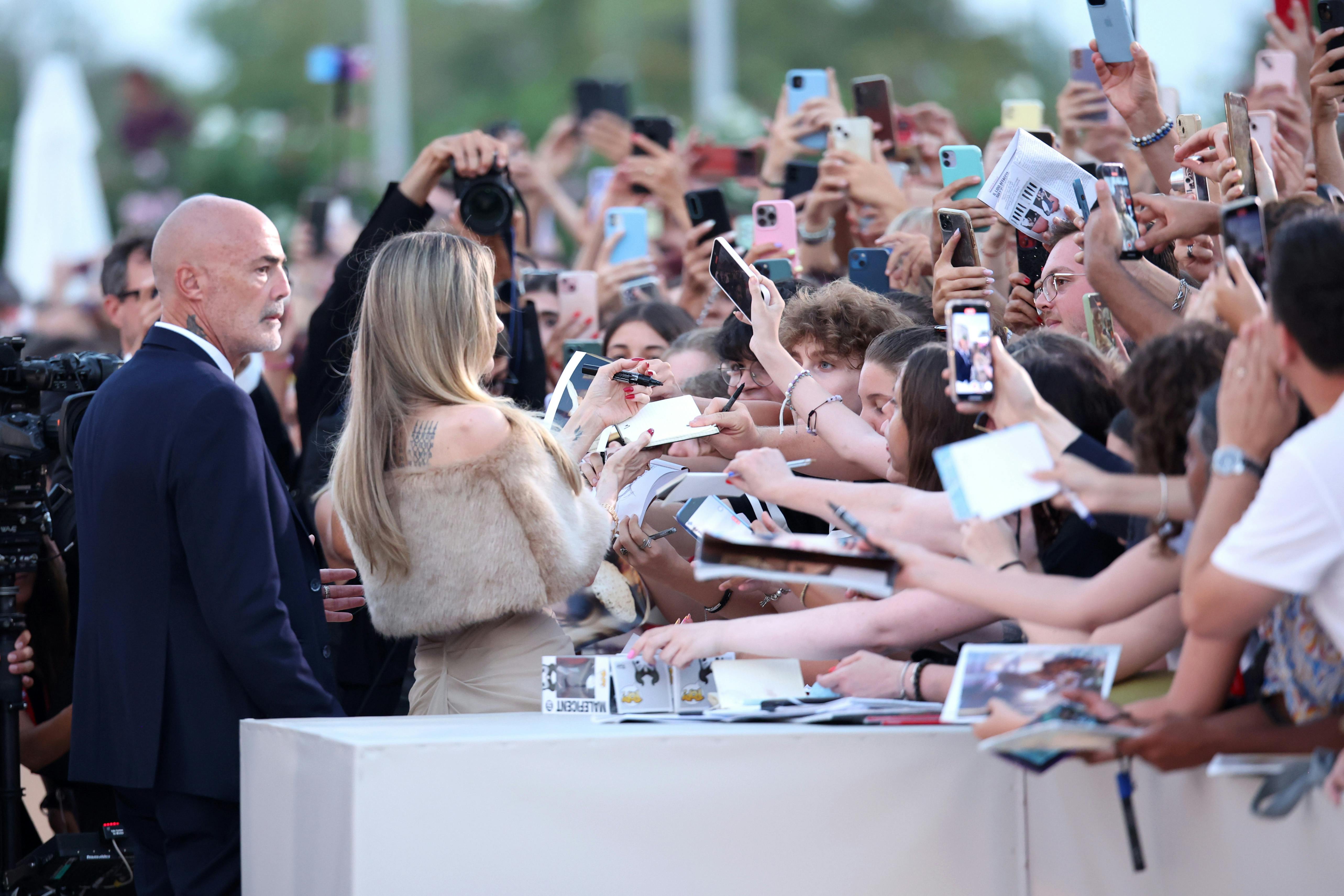 Angelina Jolie receives crowds of well-wishers and fans at a festival.