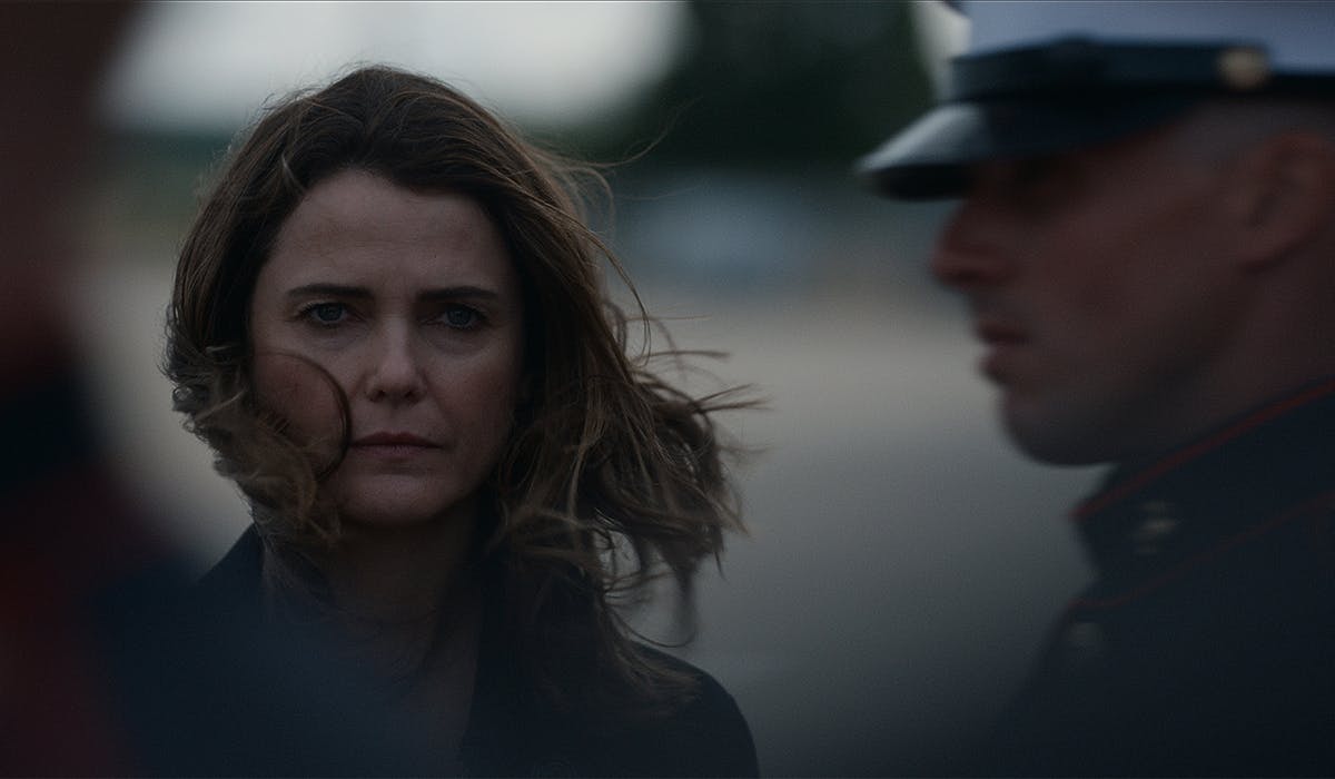 Kate Wyler (Keri Russell) looks austere in this gray, windswept up-close picture.