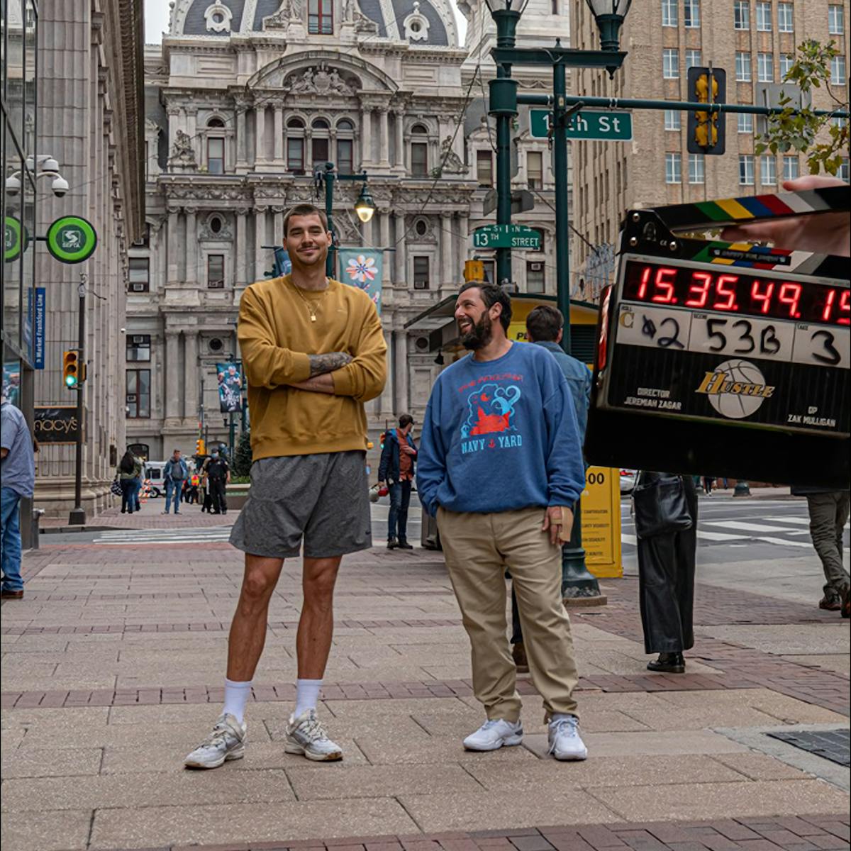 Juancho Hernangómez and Adam Sandler stand in downtown Philadelphia.