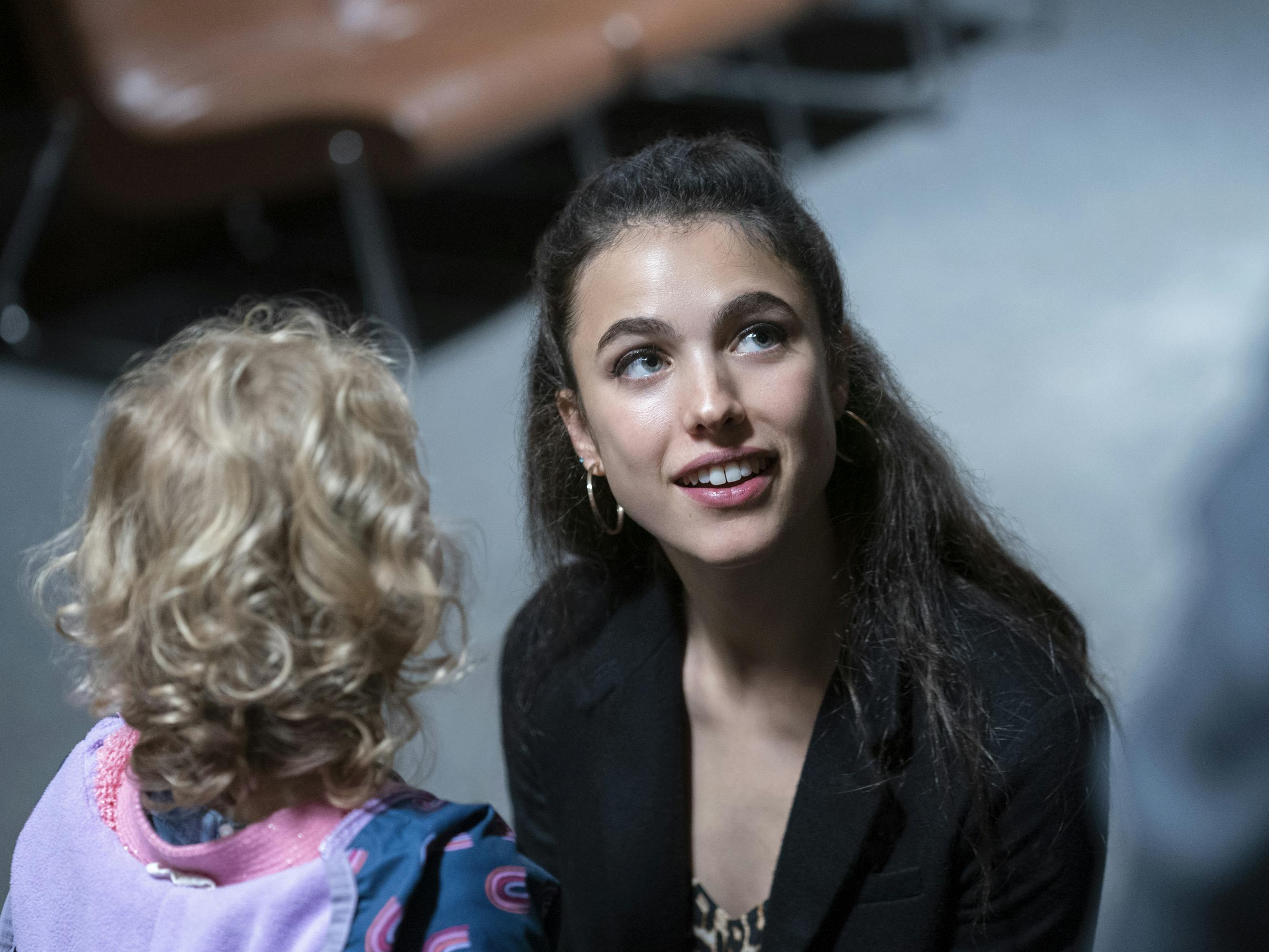 Maddy (Rylea Nevaeh Whittet) and Alex Russell (Margaret Qualley). Maddy wears a purple and pink top and Alex wears a black top and hoops.