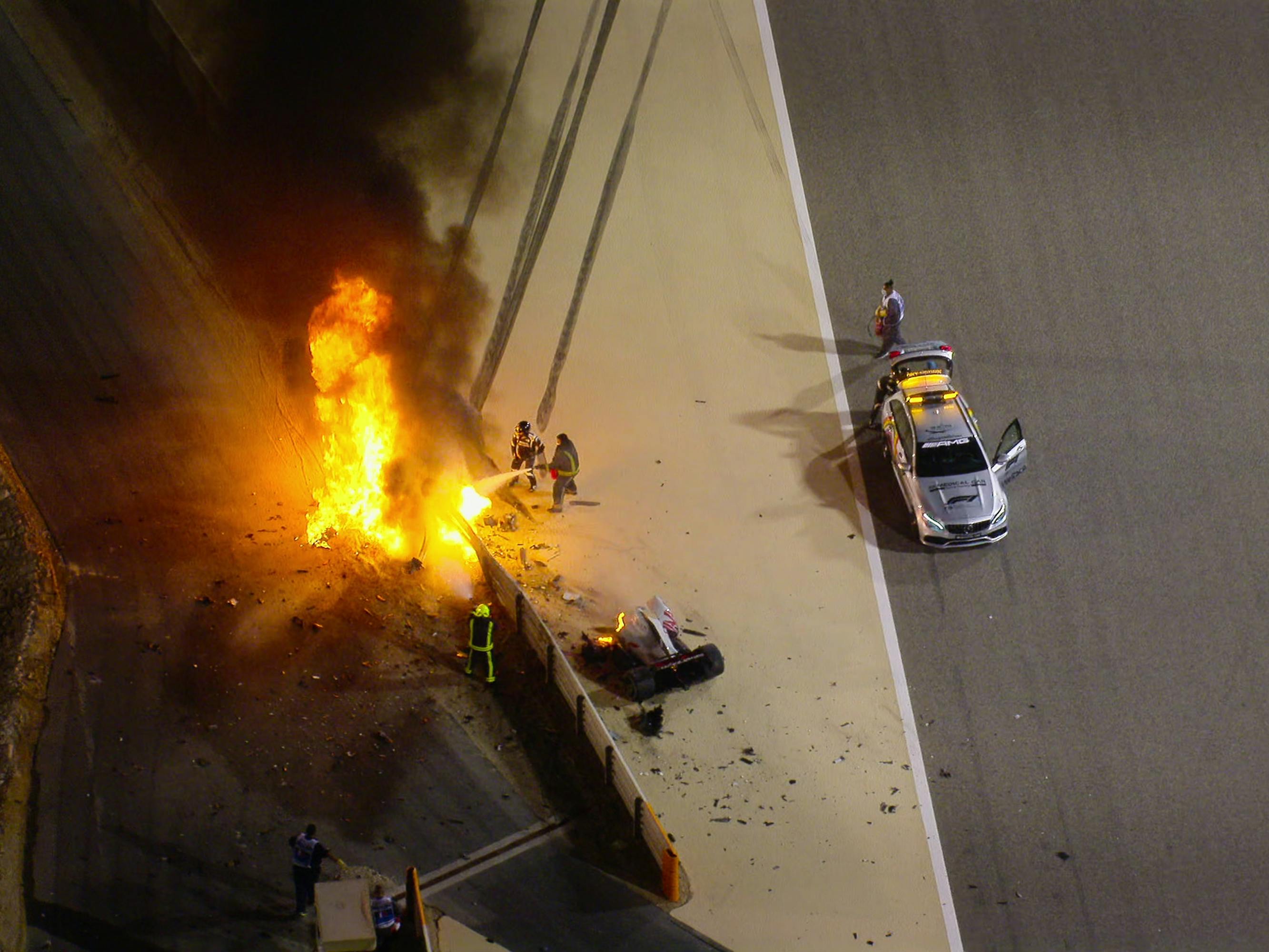 An explosion on the side of a track. Another car is pulled over on the side of the road.