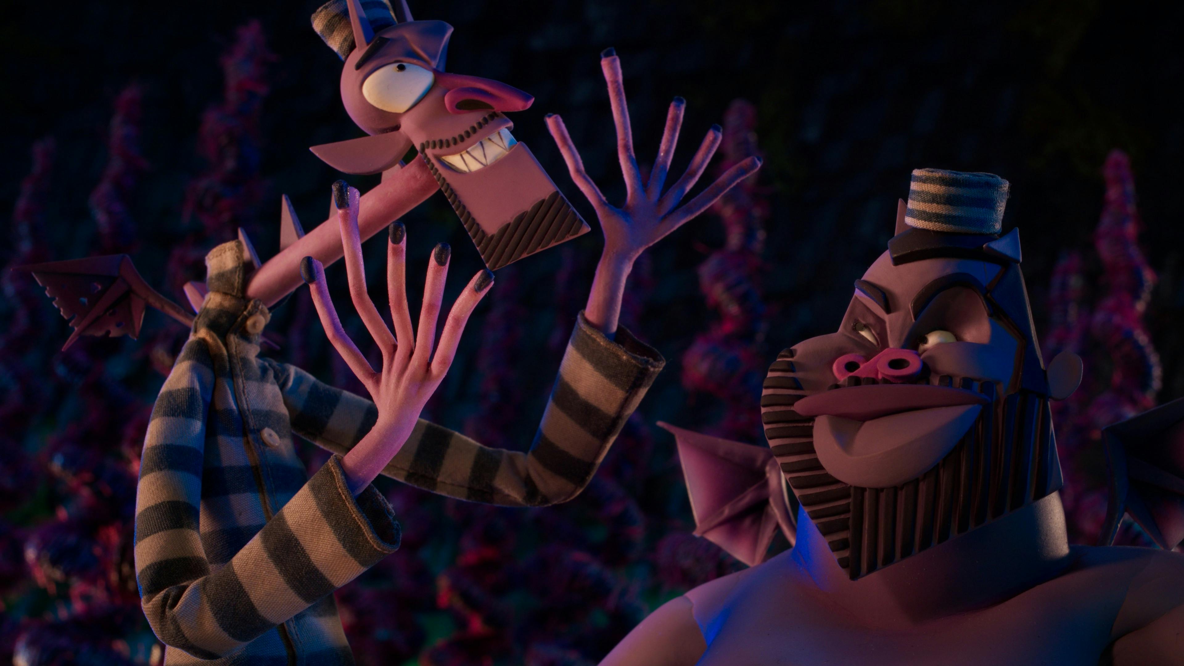 Wendell and Wild talk animatedly in the underworld, in their striped outfits complete with little caps.