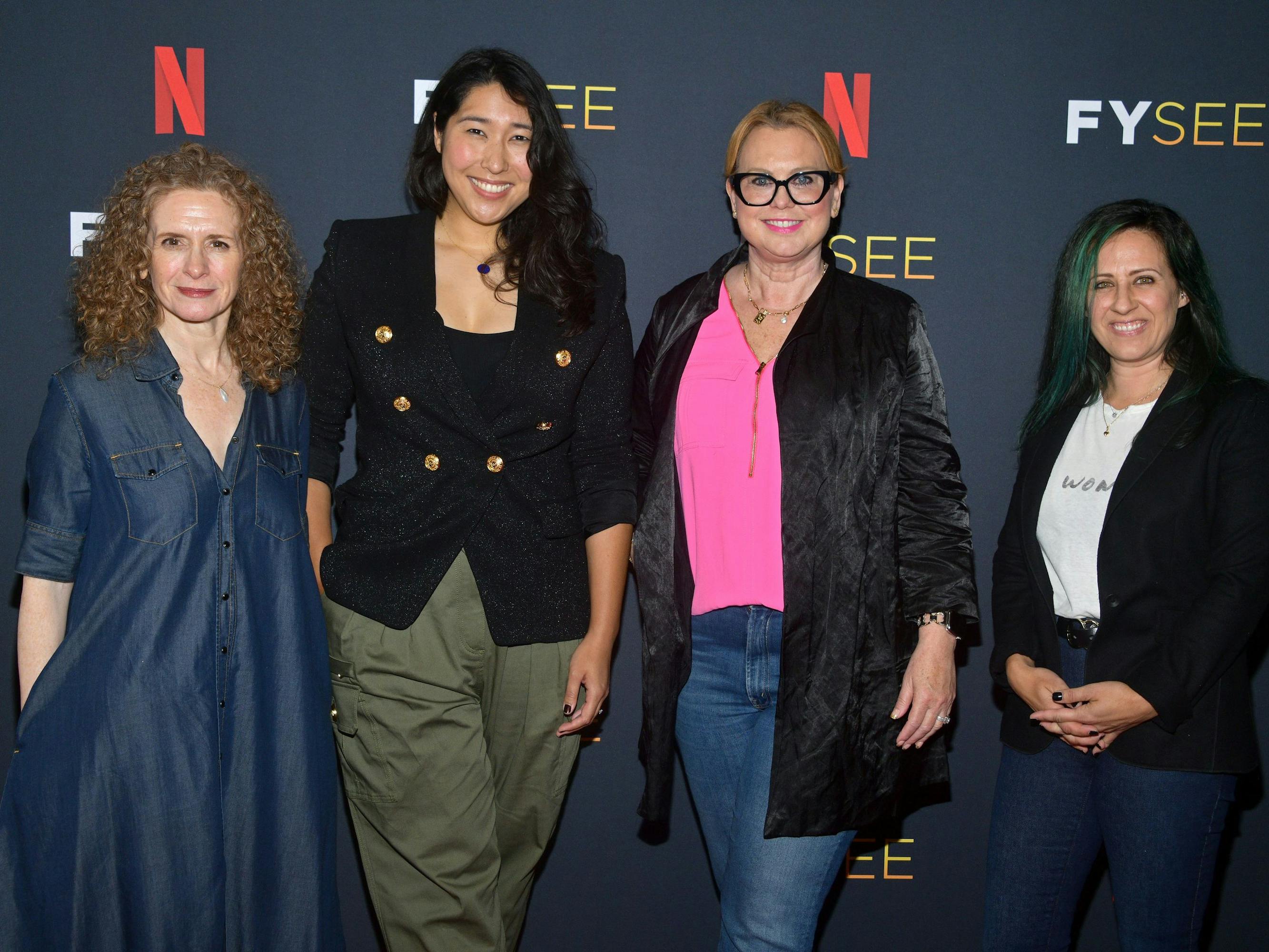 Jennifer Flackett (Big Mouth and Human Resources), Emily Dean (Love, Death + Robots), Melinda Dilger (Arcane), and Kelly Galuska (Human Resources) pose on the red carpet against a Netflix FYSEE background.