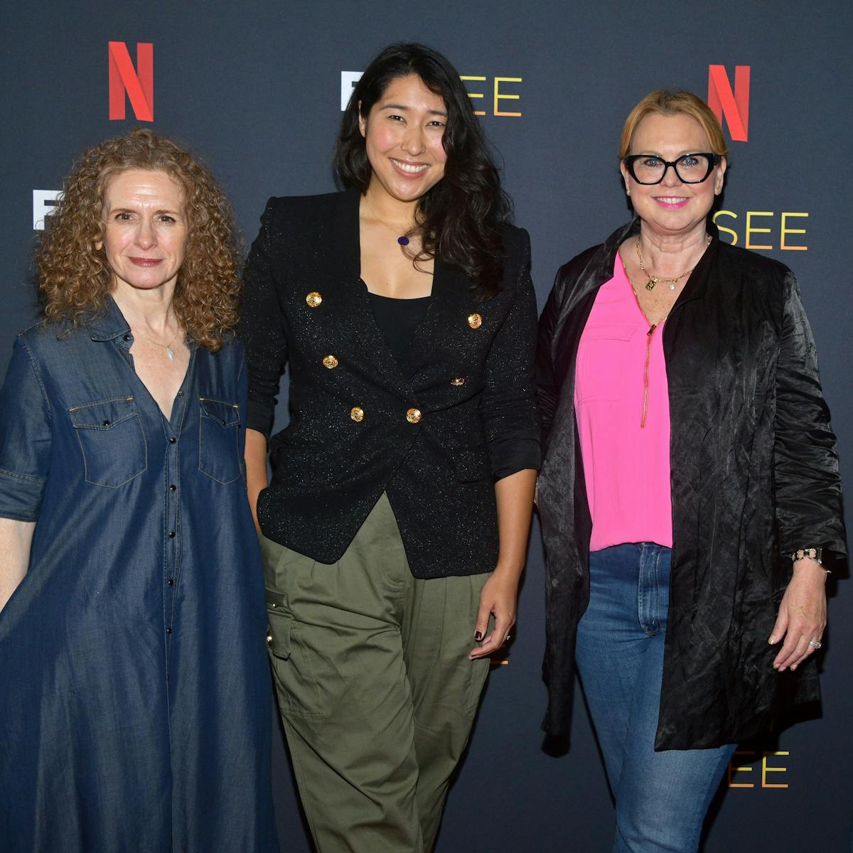 Jennifer Flackett (Big Mouth and Human Resources), Emily Dean (Love, Death + Robots), Melinda Dilger (Arcane), and Kelly Galuska (Human Resources) pose on the red carpet against a Netflix FYSEE background.