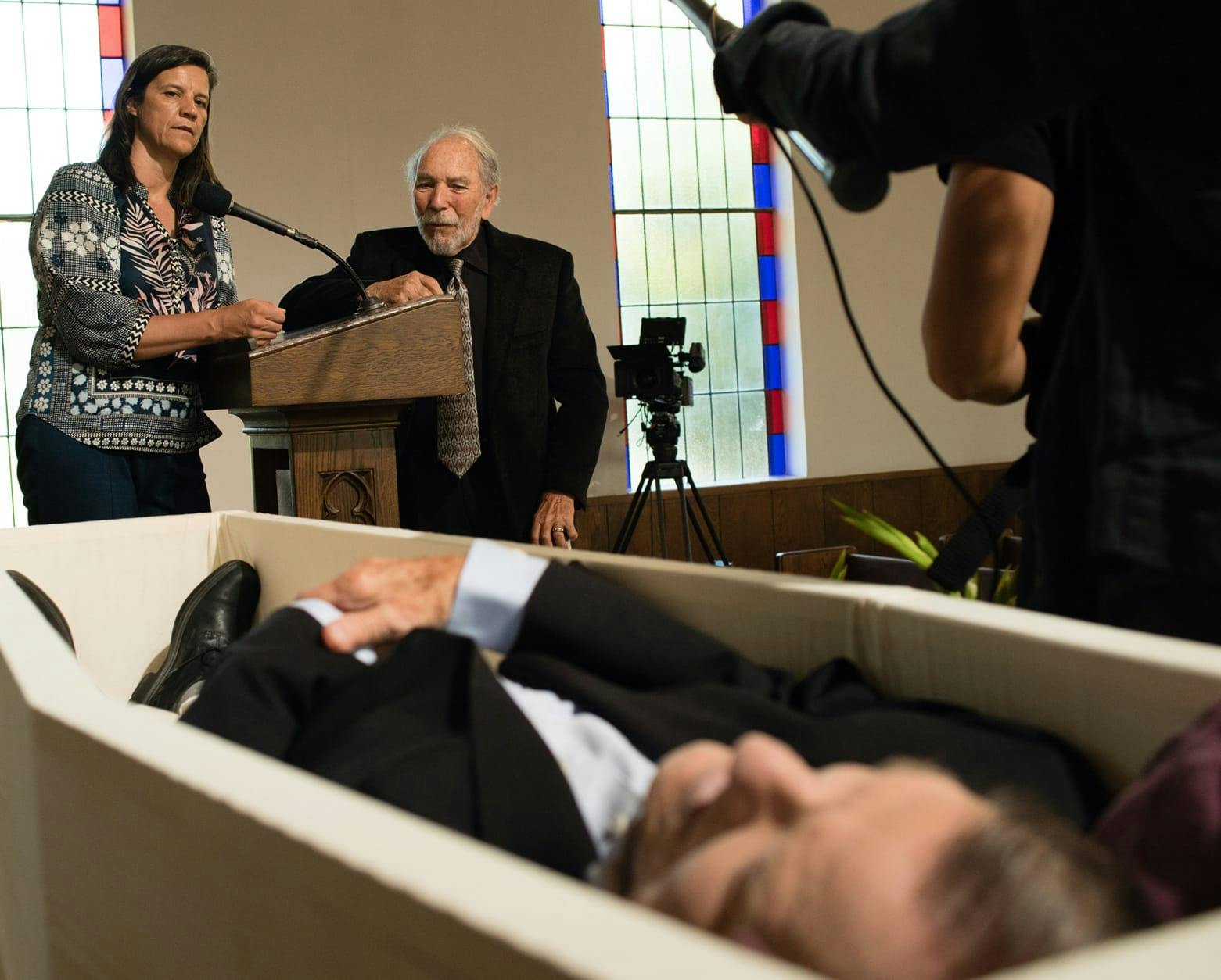 Kirsten Johnson surveys Dick Johnson in his casket