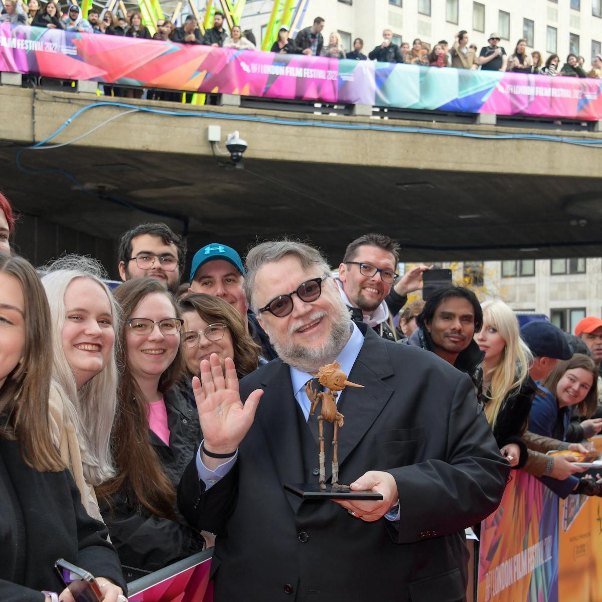 Guillermo del Toro and his Pinocchio puppet greet fans at the BFI London Film Festival.