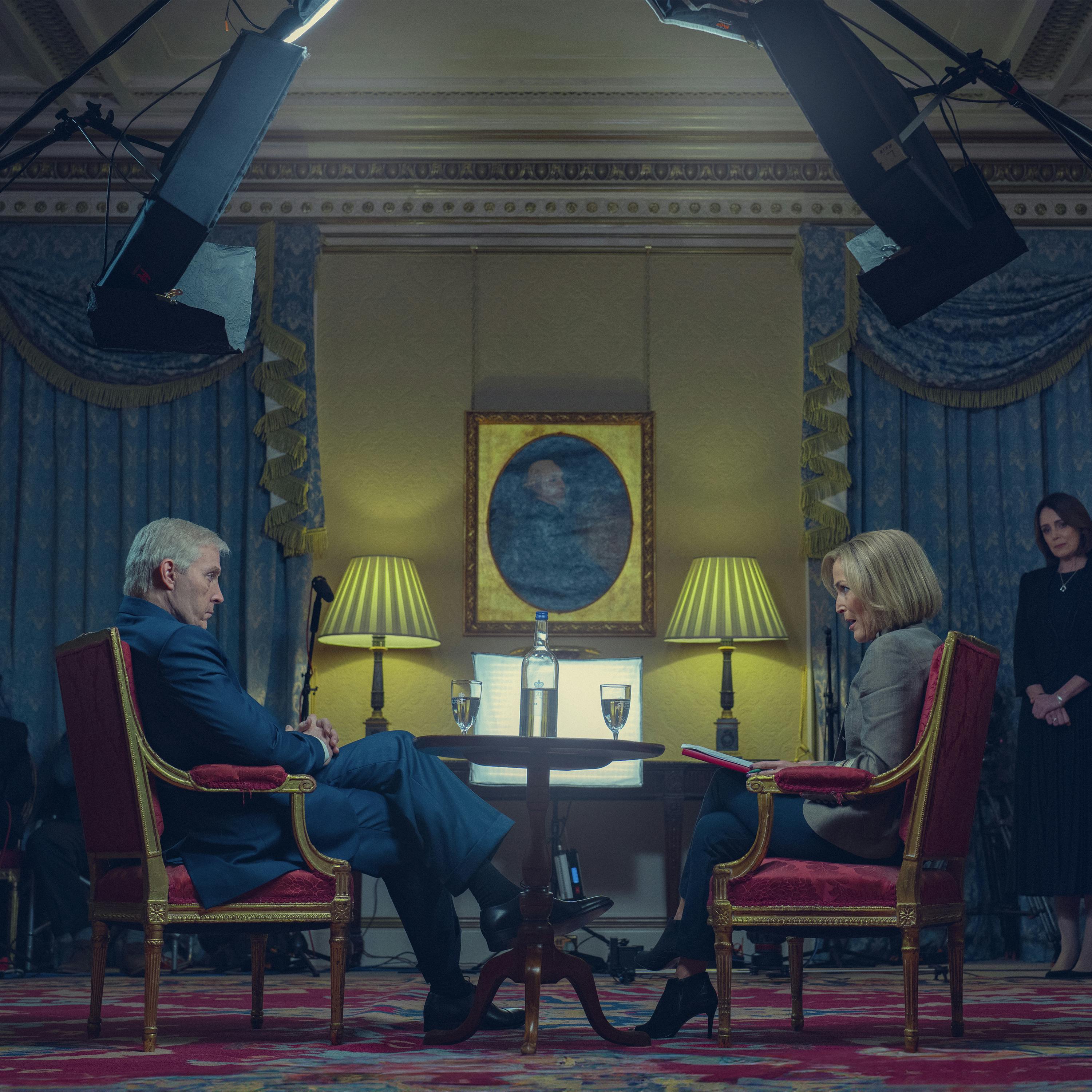 Prince Andrew (Rufus Sewell) and Emily Maitlis (Gillian Anderson) face off in a royal-looking room.