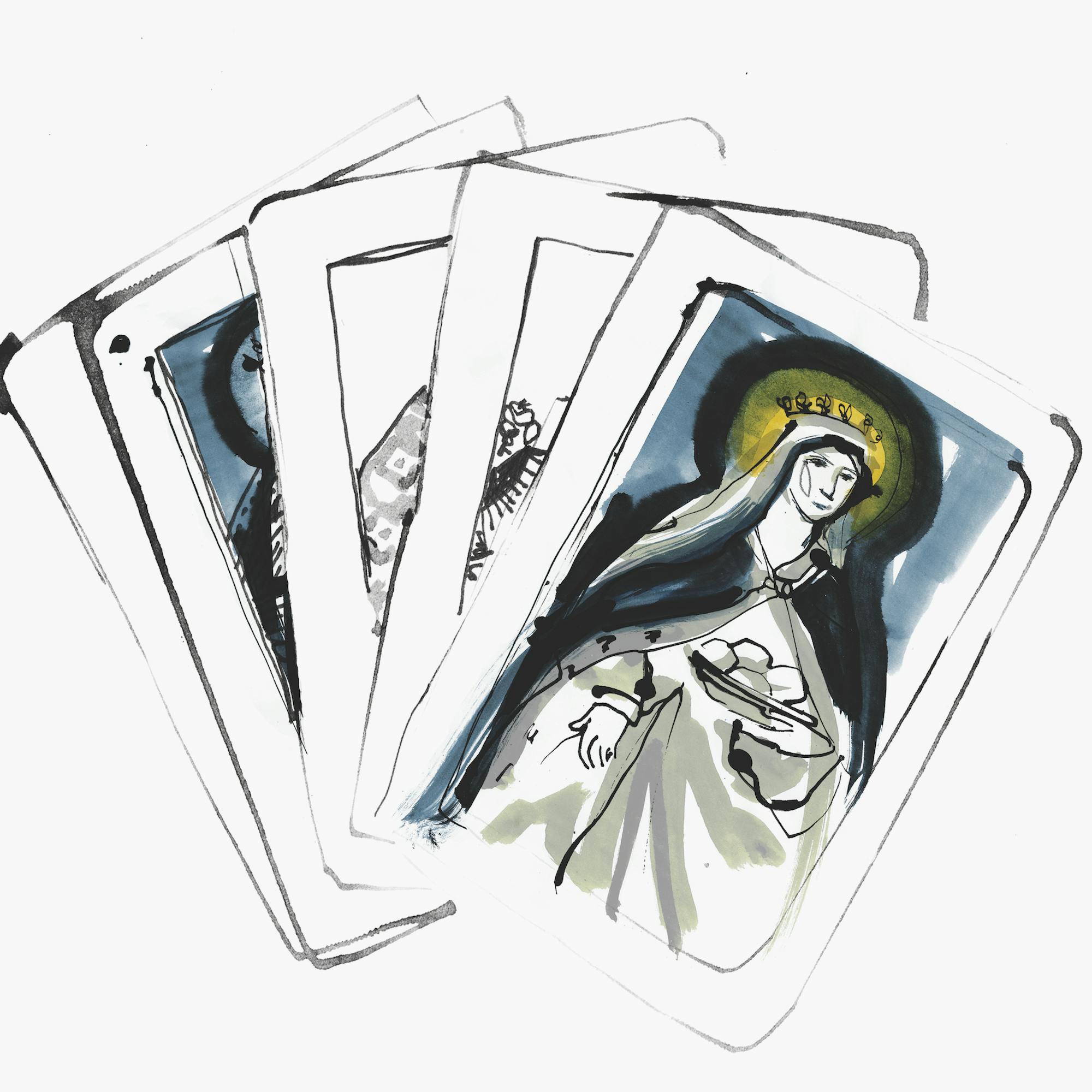 Some cards with a religious-looking lady painted in navy and yellow.