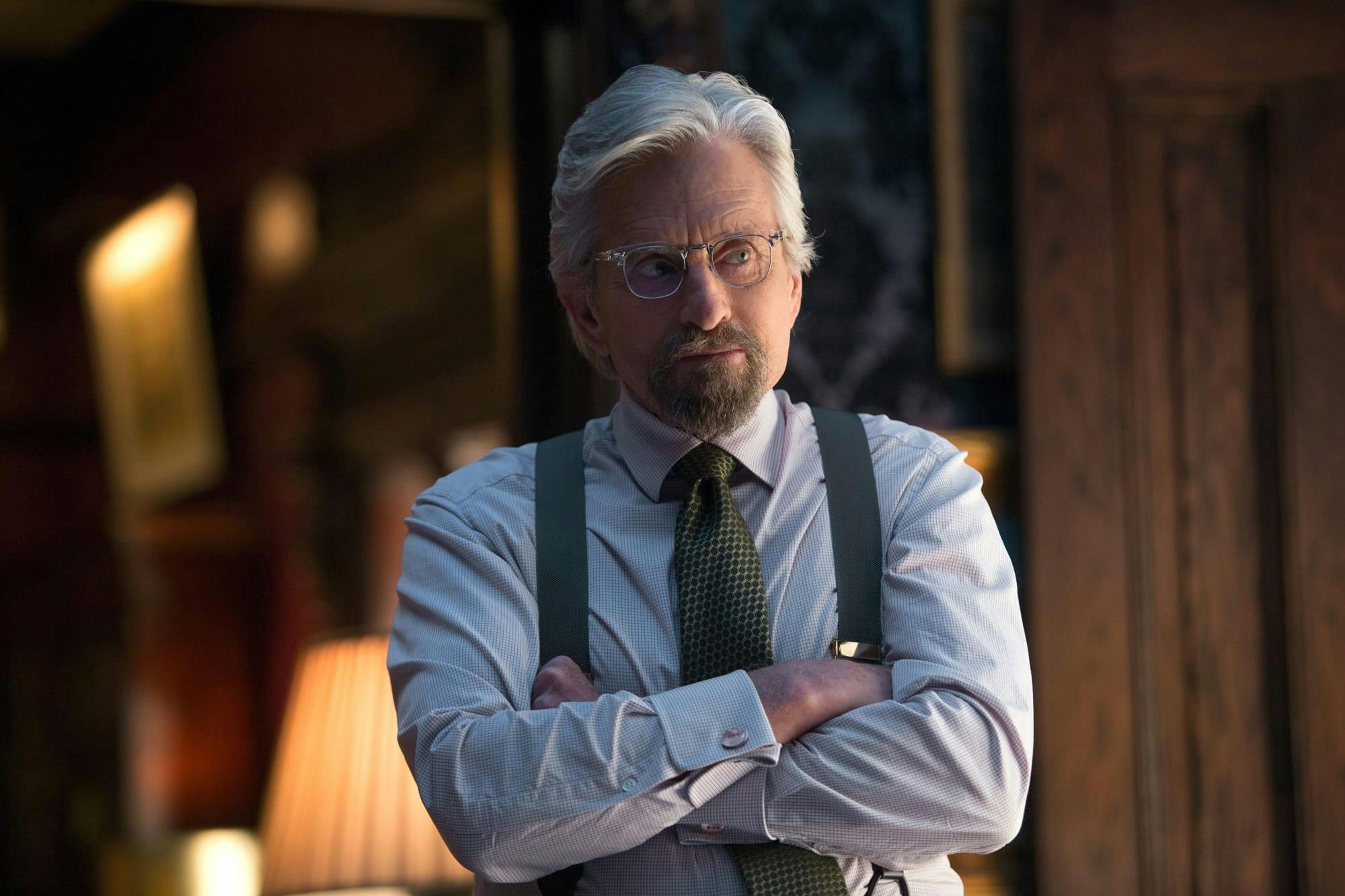 Dr. Hank Pym (Michael Douglas) in Ant-Man stands wearing suspenders (again!) folding his arms across his chest.