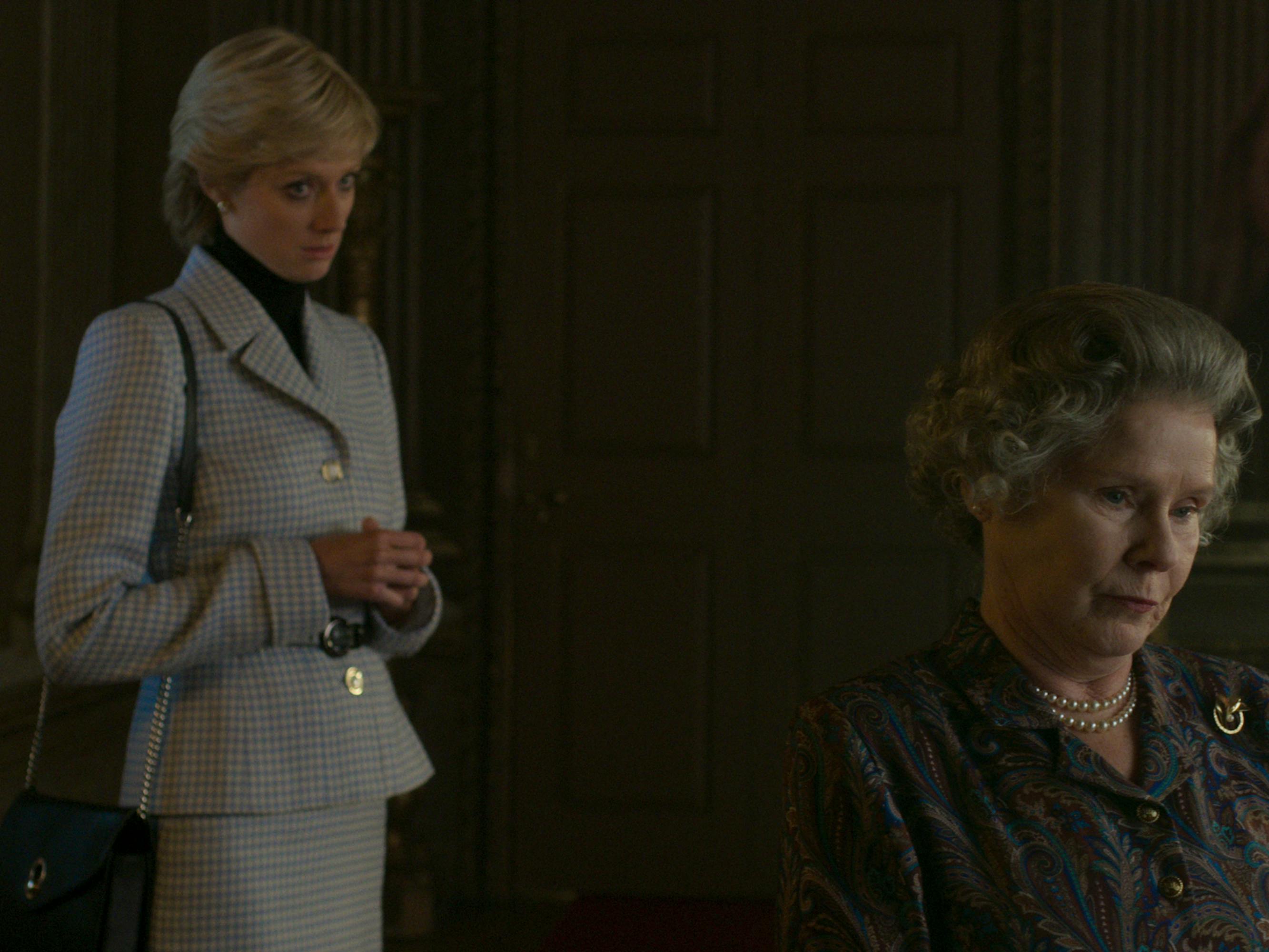 There's some brutal tension between Princess Diana (Elizabeth Debicki) and Queen Elizabeth (Imelda Staunton) in this darkened shot.