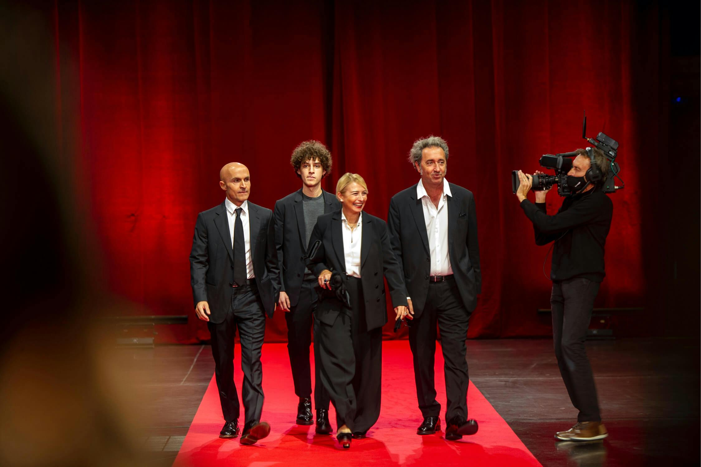 Lorenzo Mieli, Filippo Scotti, Daniele D'Antonio, and Paolo Sorrentino walk along the red carpet