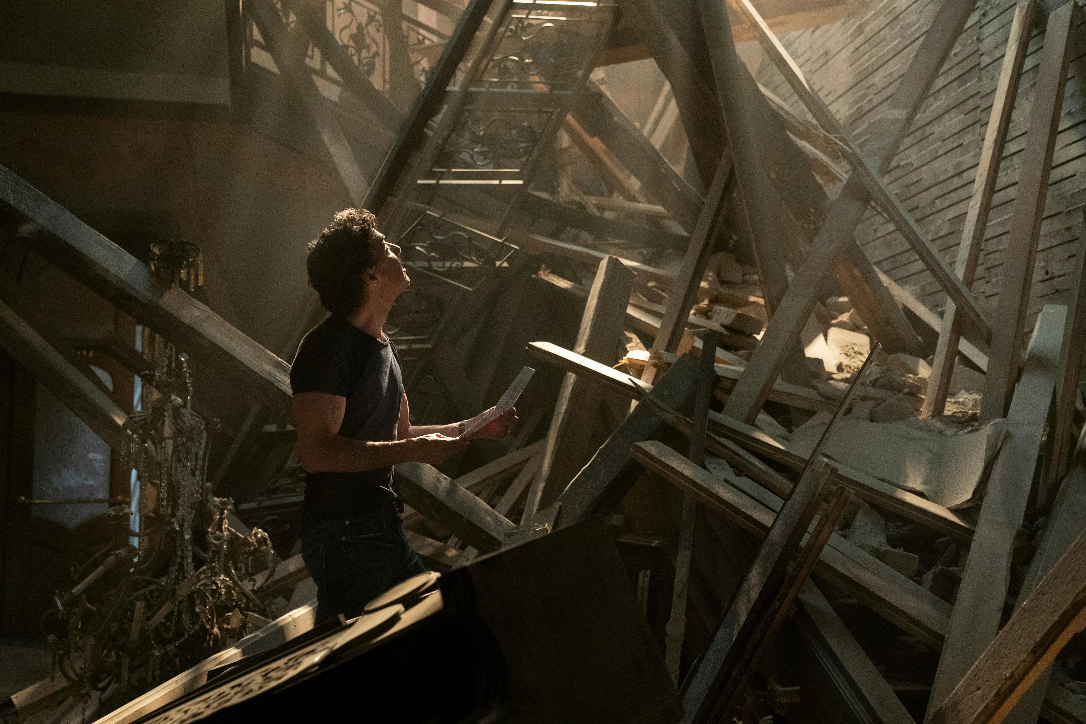 Shawn Levy makes his way through some wooden rubble.
