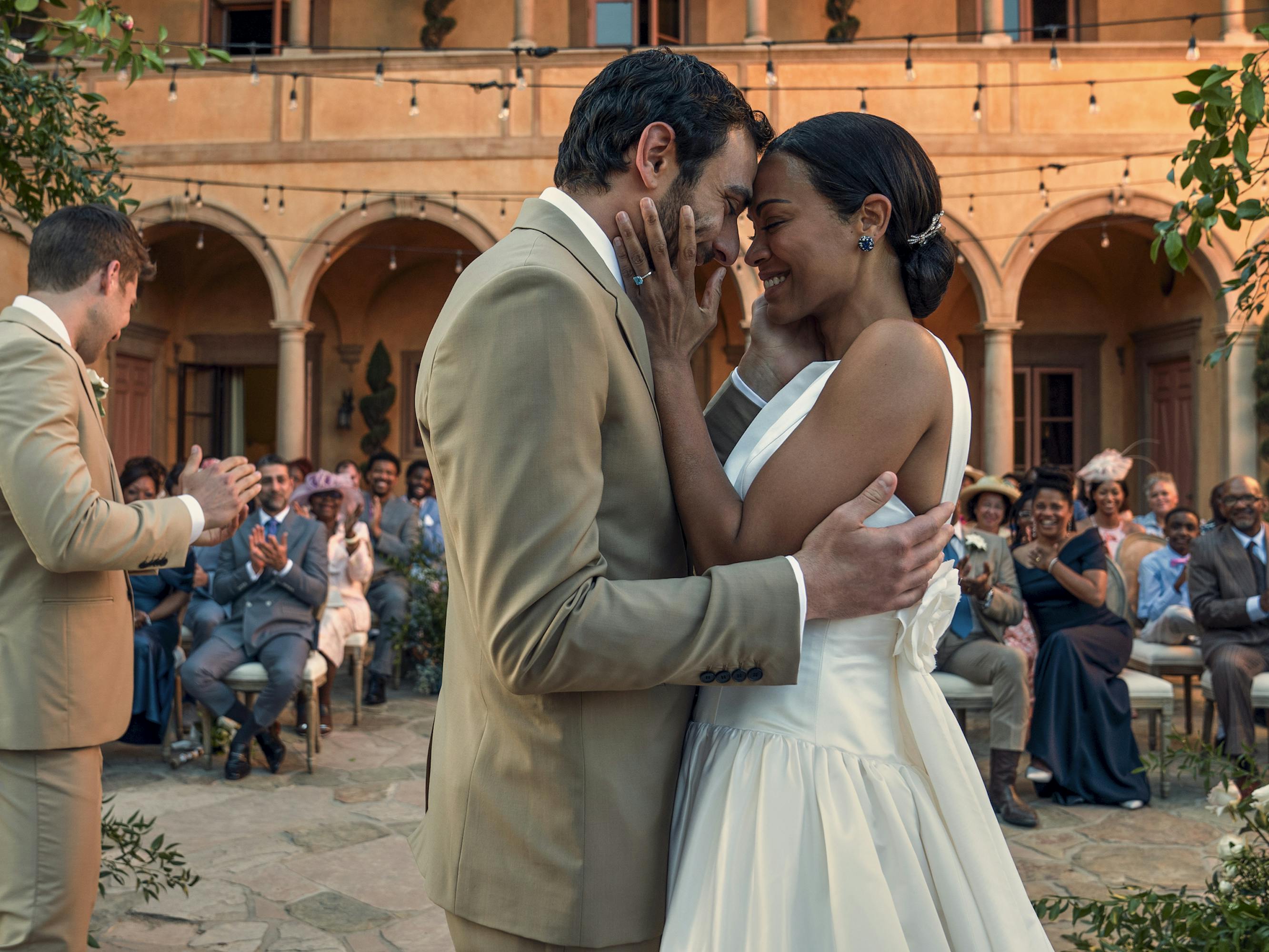 Amy Wheeler (Zoe Saldana) and Lino Ortolano (Eugenio Mastrandrea) dance together at their wedding.