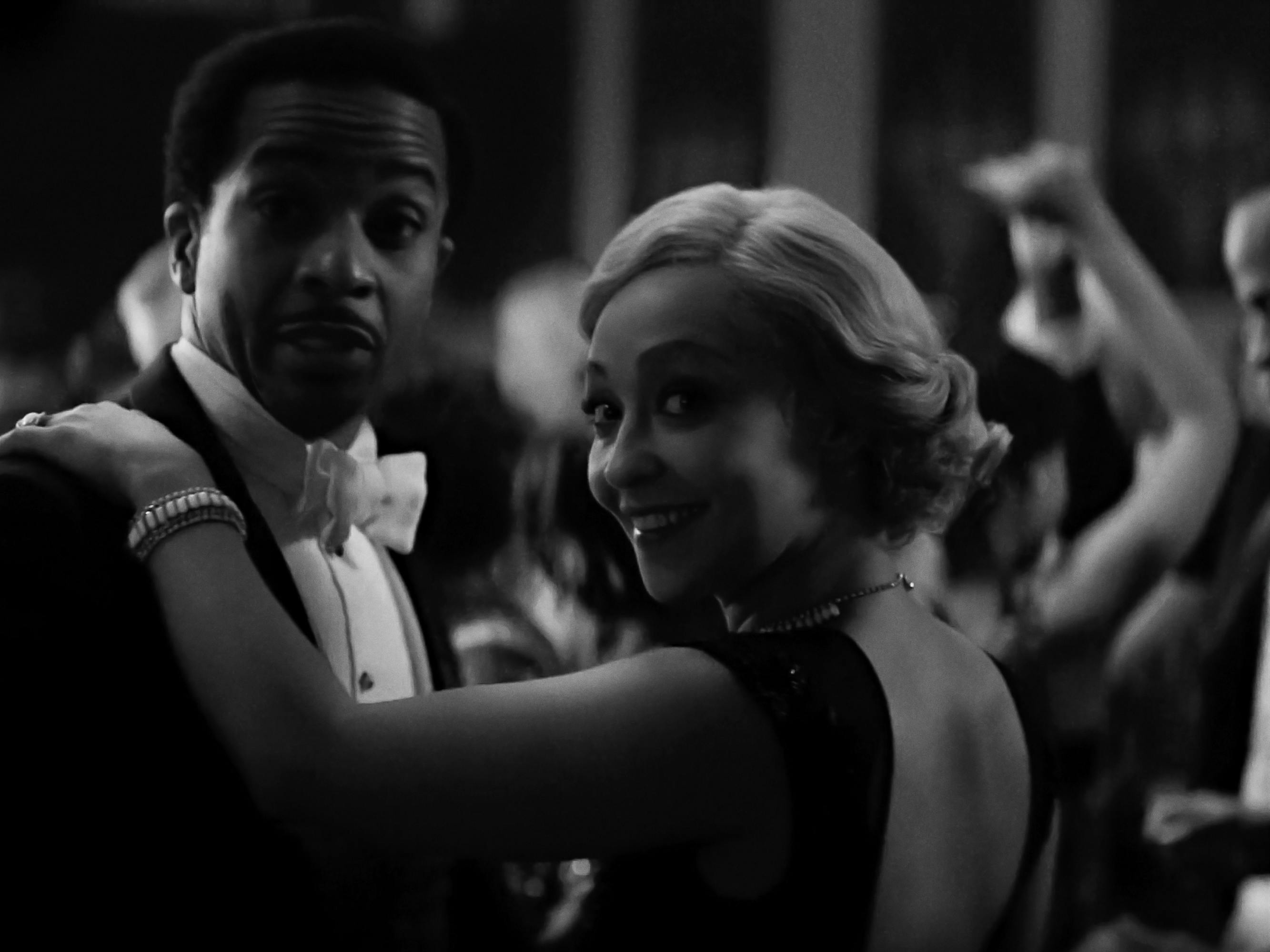 André Holland and Ruth Negga dance together in this black-and-white shot.