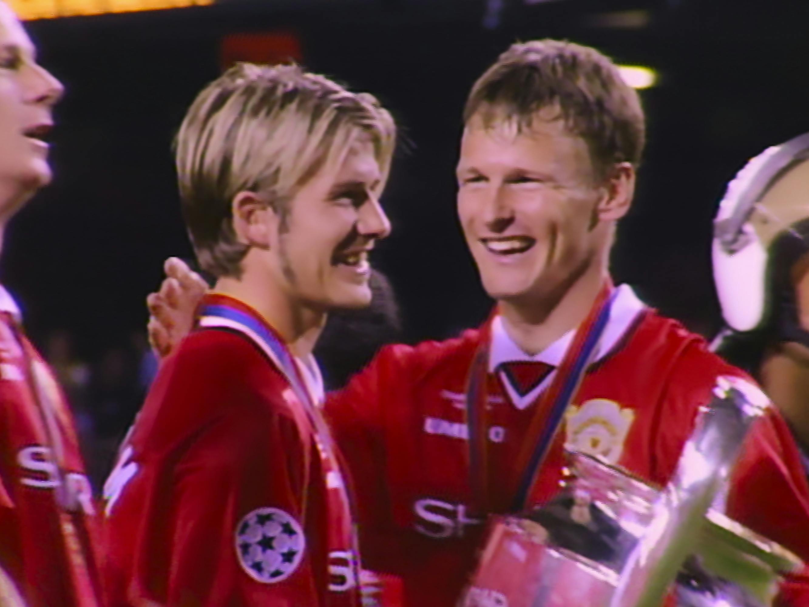 David Beckham and Sami Hyypiä celebrate with big smiles. I wish my hair were as floppy as Beckham’s!