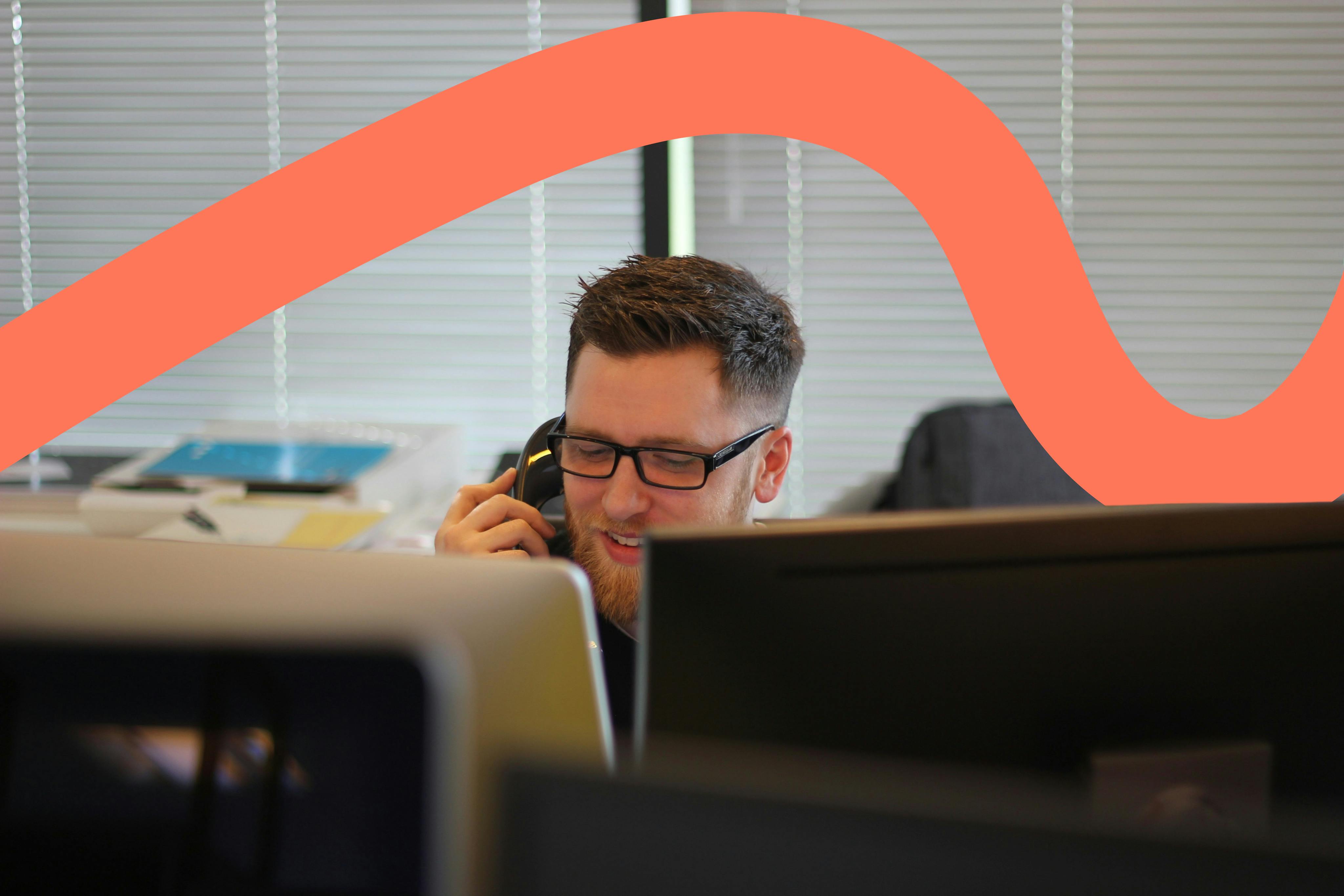 IT support technician on telephone in the office