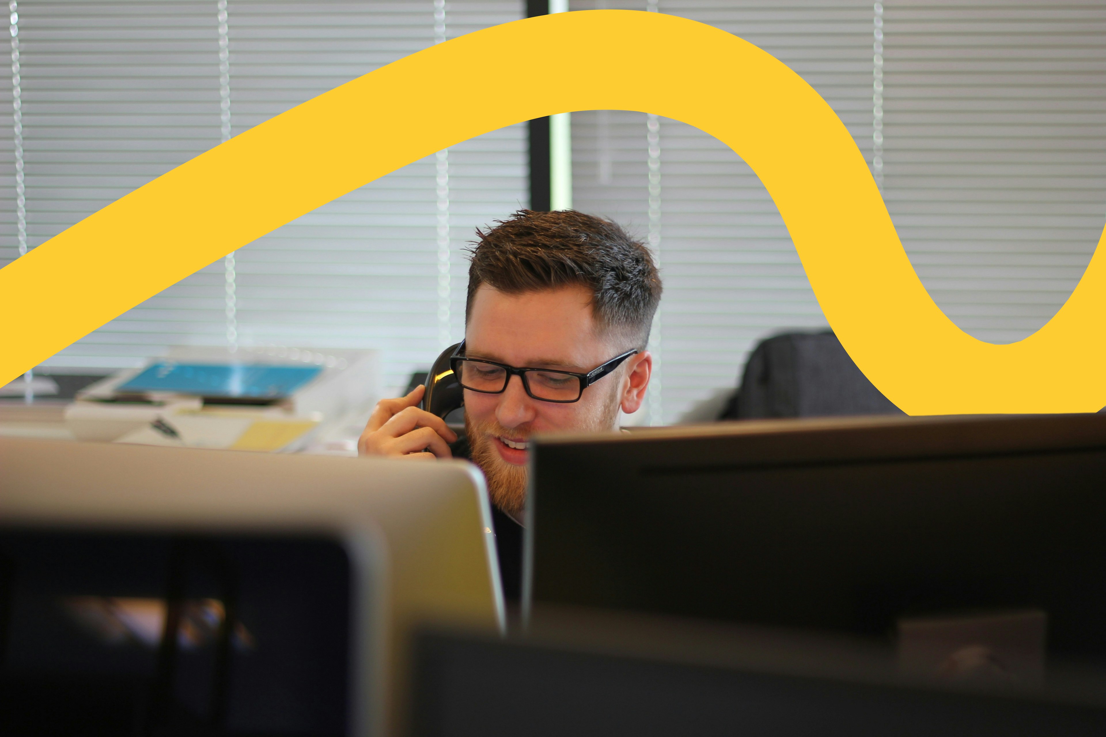 IT support technician on telephone in the office