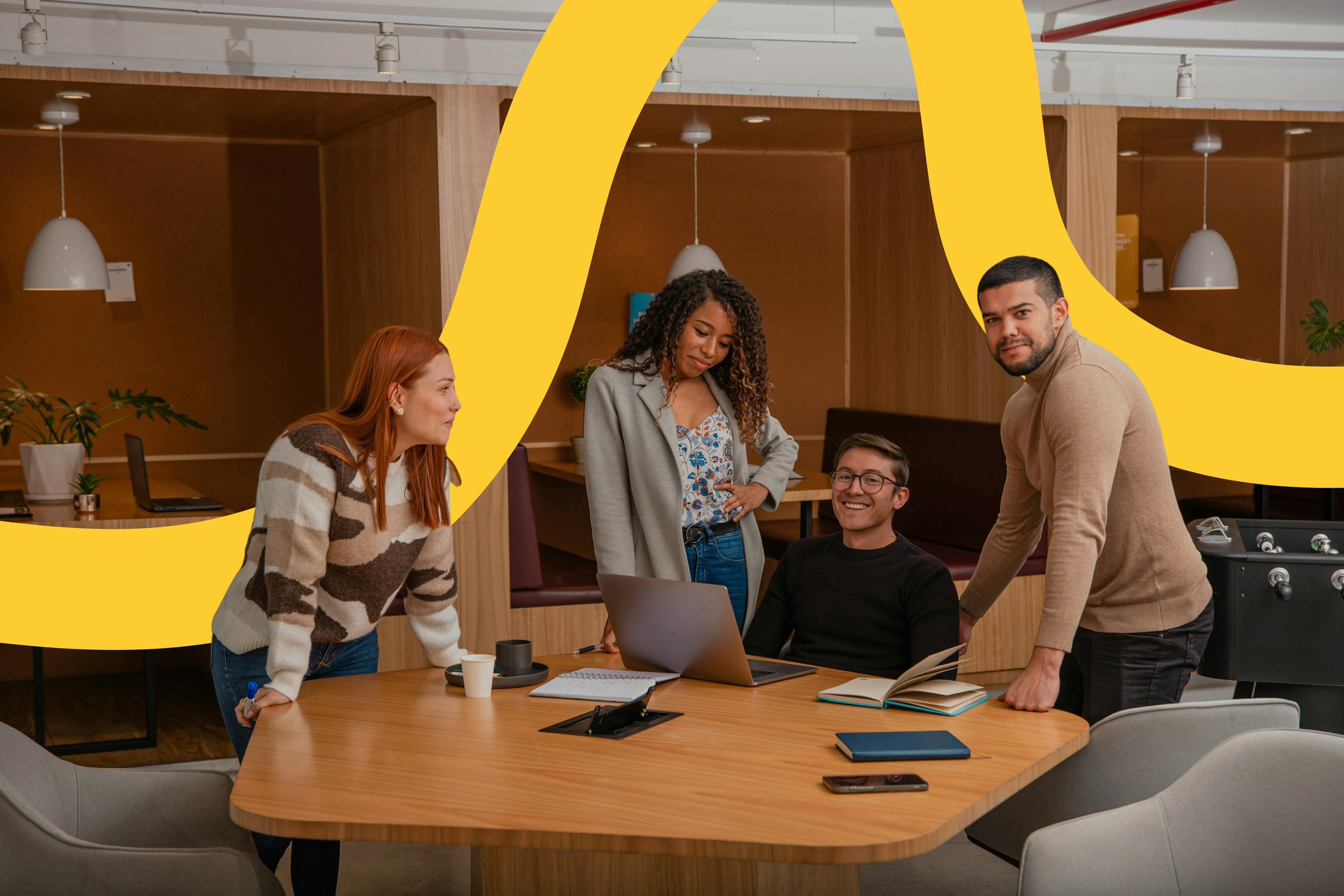 group It services team in office with a yellow swirl