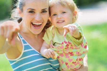 Mum and baby pointing and smiling