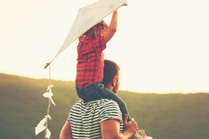 Girl and dad with a kite