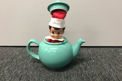 Elf on the Shelf hiding in teapot