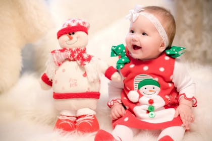 baby girl in christmas snowman dress 