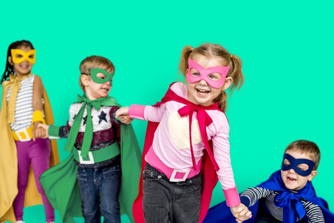 Group of children dressed as superheros