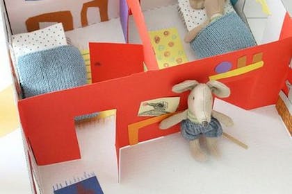A house made out of a shoebox for toy mice